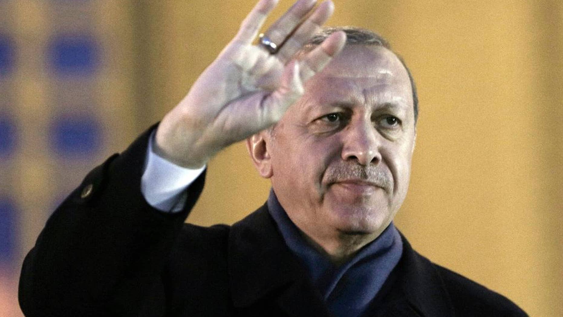 Turkey's President Recep Tayyip Erdogan gestures as he delivers a speech during a rally of supporters a day after the referendum, at his palace, in Ankara, Turkey, Monday, April 17, 2017. Turkey's main opposition party urged the country's electoral board Monday to cancel the results of a landmark referendum that granted sweeping new powers to Erdogan, citing what it called substantial voting irregularities. (AP Photo/Burhan Ozbilici)