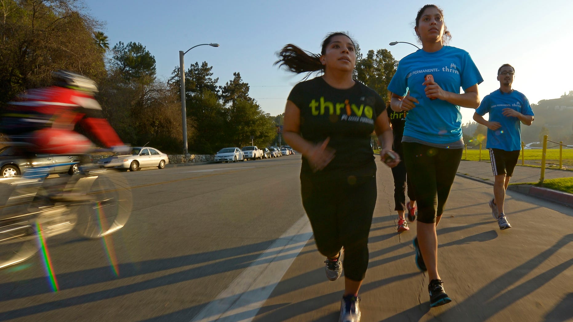Dec. 11, 2012: In this photo, Zendi Solano, center, trains with running club members Rian Barrett, second from right, and Richard Chen in Pasadena, Calif.