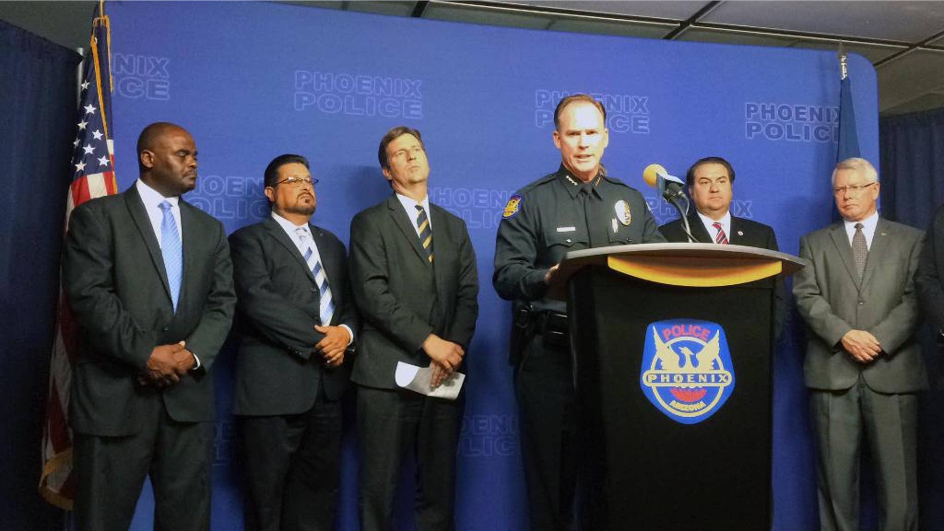 Phoenix Police Chief Joseph Yahner speaks at a news conference surrounded by officials in Phoenix on Thursday, Aug. 25, 2016. Phoenix police renewed pleas to the public Thursday for information that could help catch a serial killer who has been stalking predominantly Hispanic neighborhoods. (AP Photo/Terry Tang)