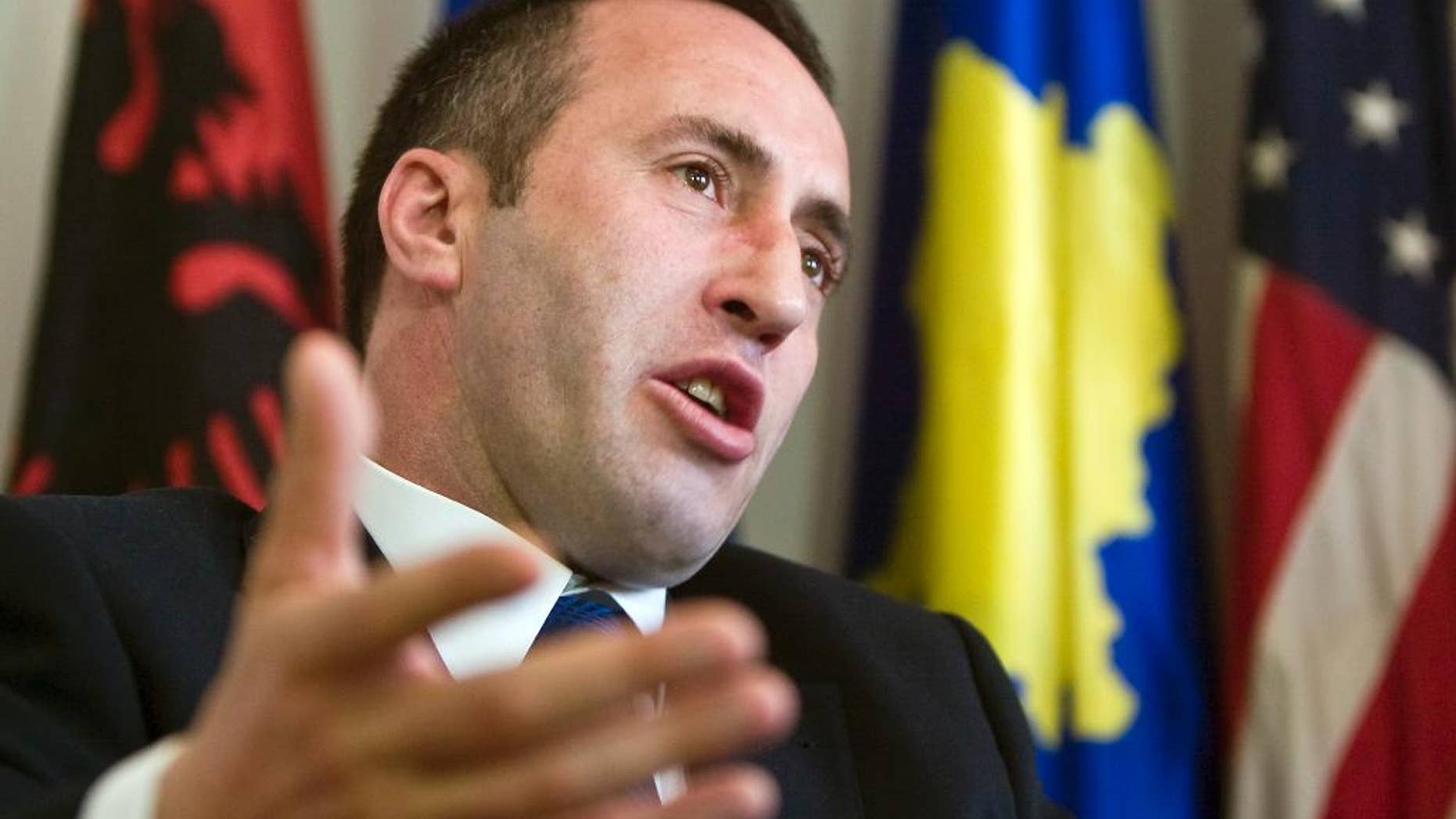 FILE - In this file photo dated Tuesday, April 22, 2008, Kosovo's former prime minister Ramush Haradinaj gestures during an interview with The Associated Press in Kosovo's capital Pristina. Kosovo's foreign ministry said in a statement Wednesday Jan. 4, 2017, that French police have detained Haradinaj based on an arrest warrant issued by Serbia. (AP Photo/Visar Kryeziu, FILE)