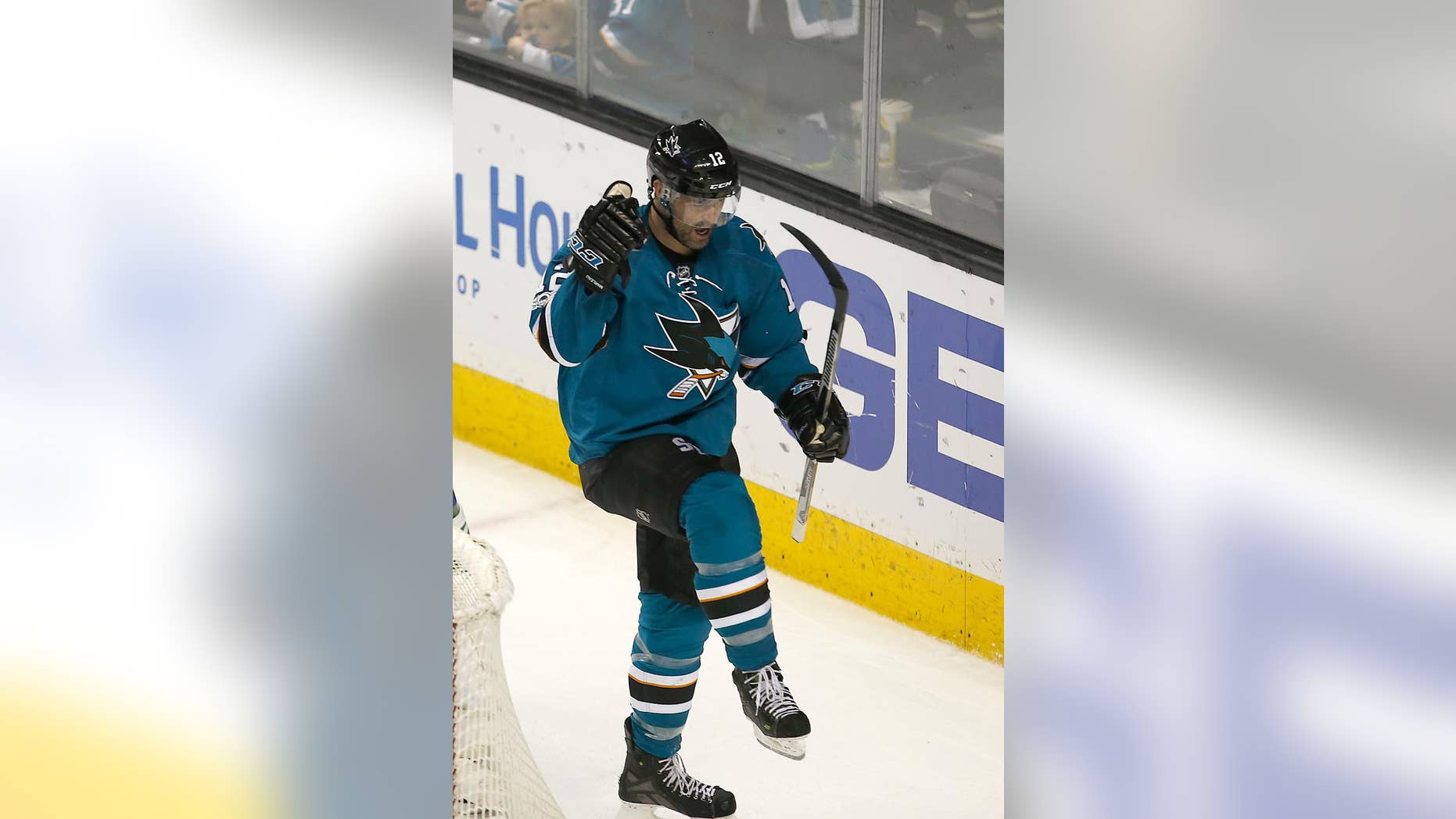 San Jose Sharks center Patrick Marleau (12) celebrates after scoring a goal against the Edmonton Oilers during the third period in Game 6 of a first-round NHL hockey playoff series Saturday, April 22, 2017, in San Jose, Calif. The Oilers won 3-1. (AP Photo/Tony Avelar)