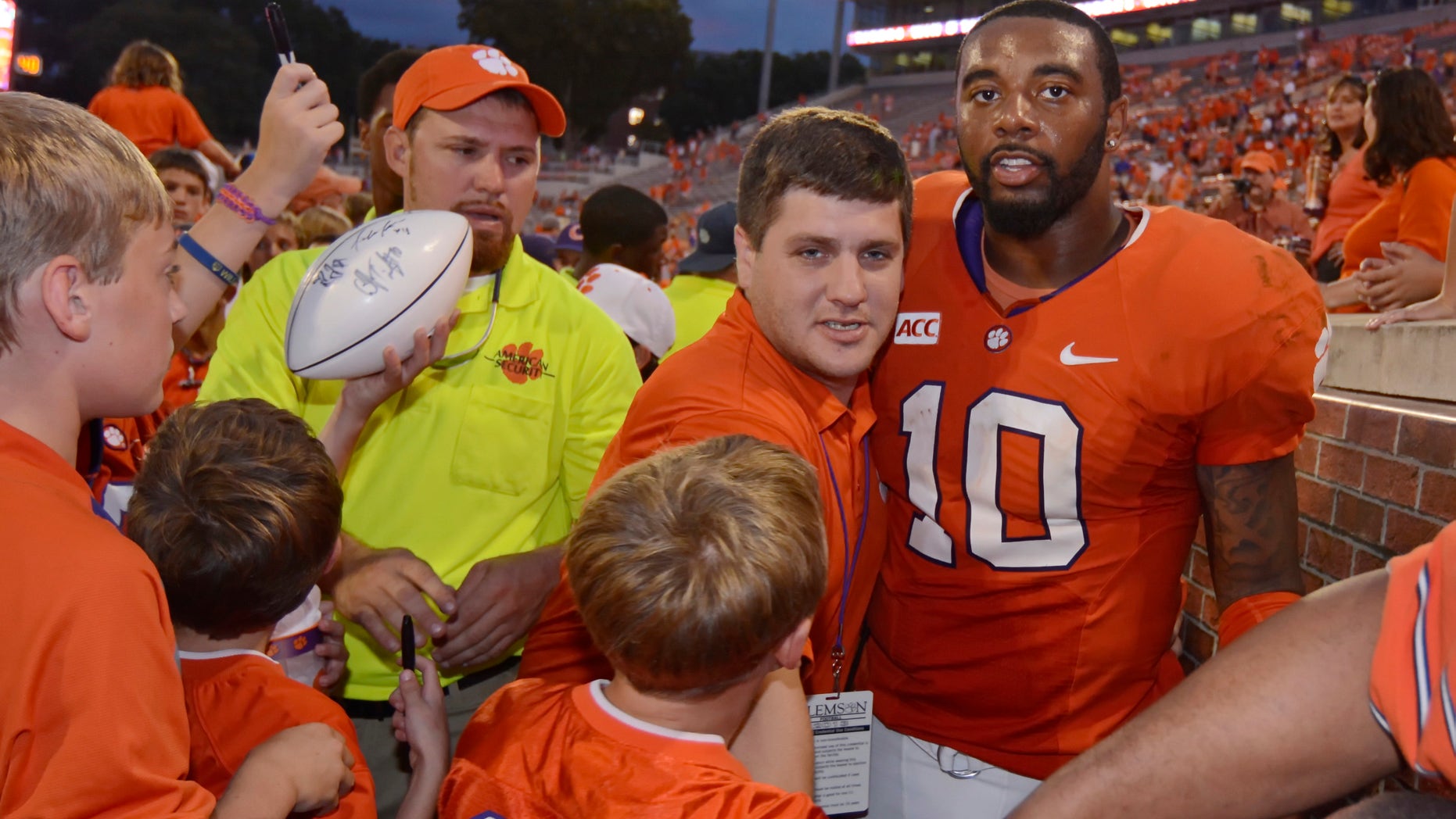 Clemson quarterback Tajh Boyd (10) is surrounded by fans while being escorted off of the field after defeating Boston College 24-14 in an NCAA college football game on Saturday, Oct. 12, 2013, at Memorial Stadium in Clemson, S.C. (AP Photo/ Richard Shiro)