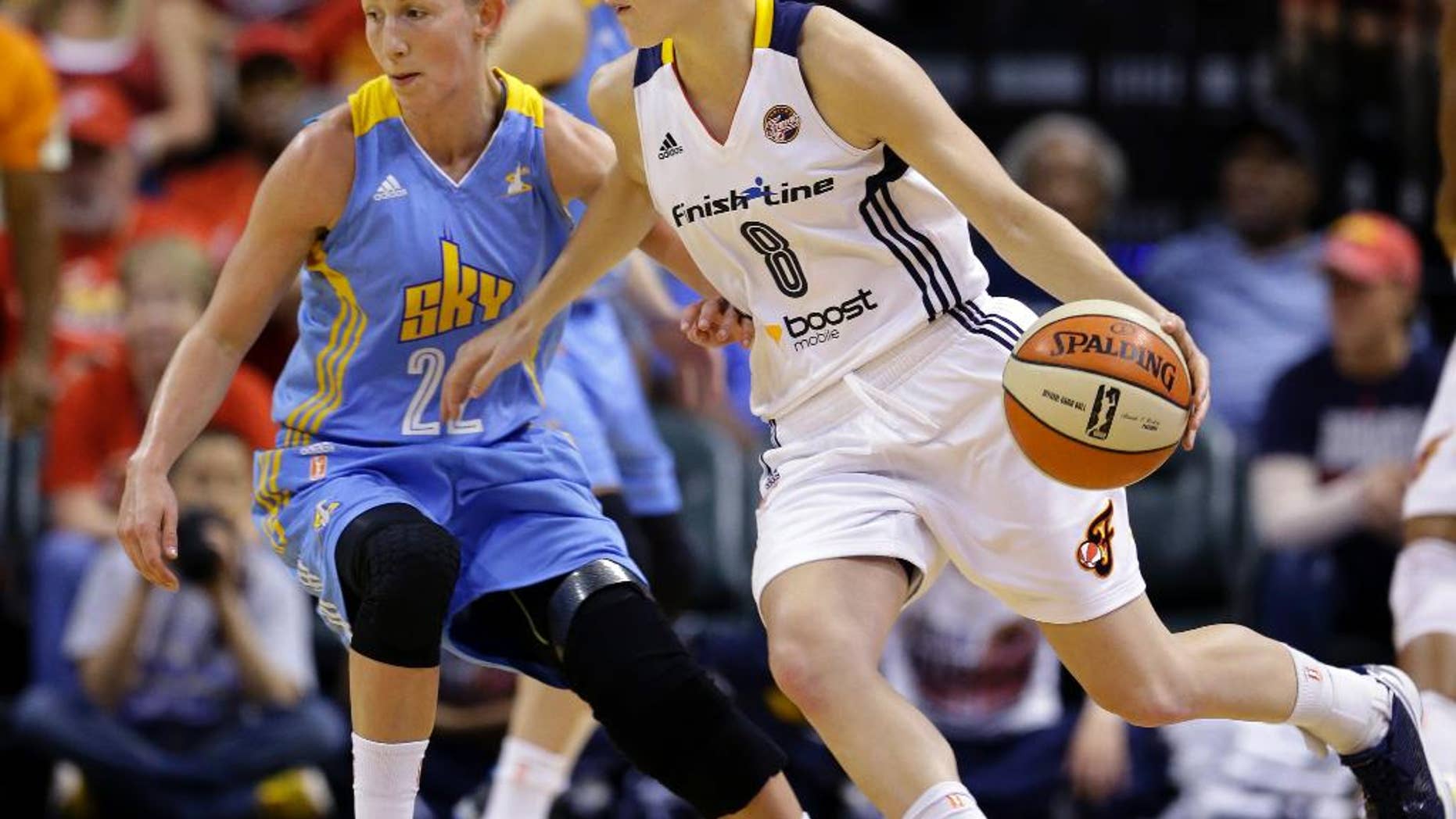 Indiana Fever guard Maggie Lucas, right, drives on Chicago Sky guard Courtney Vandersloot in the first half of Game 3 of the WNBA Eastern Conference basketball finals in Indianapolis, Wednesday, Sept. 3, 2014. (AP Photo/Michael Conroy)