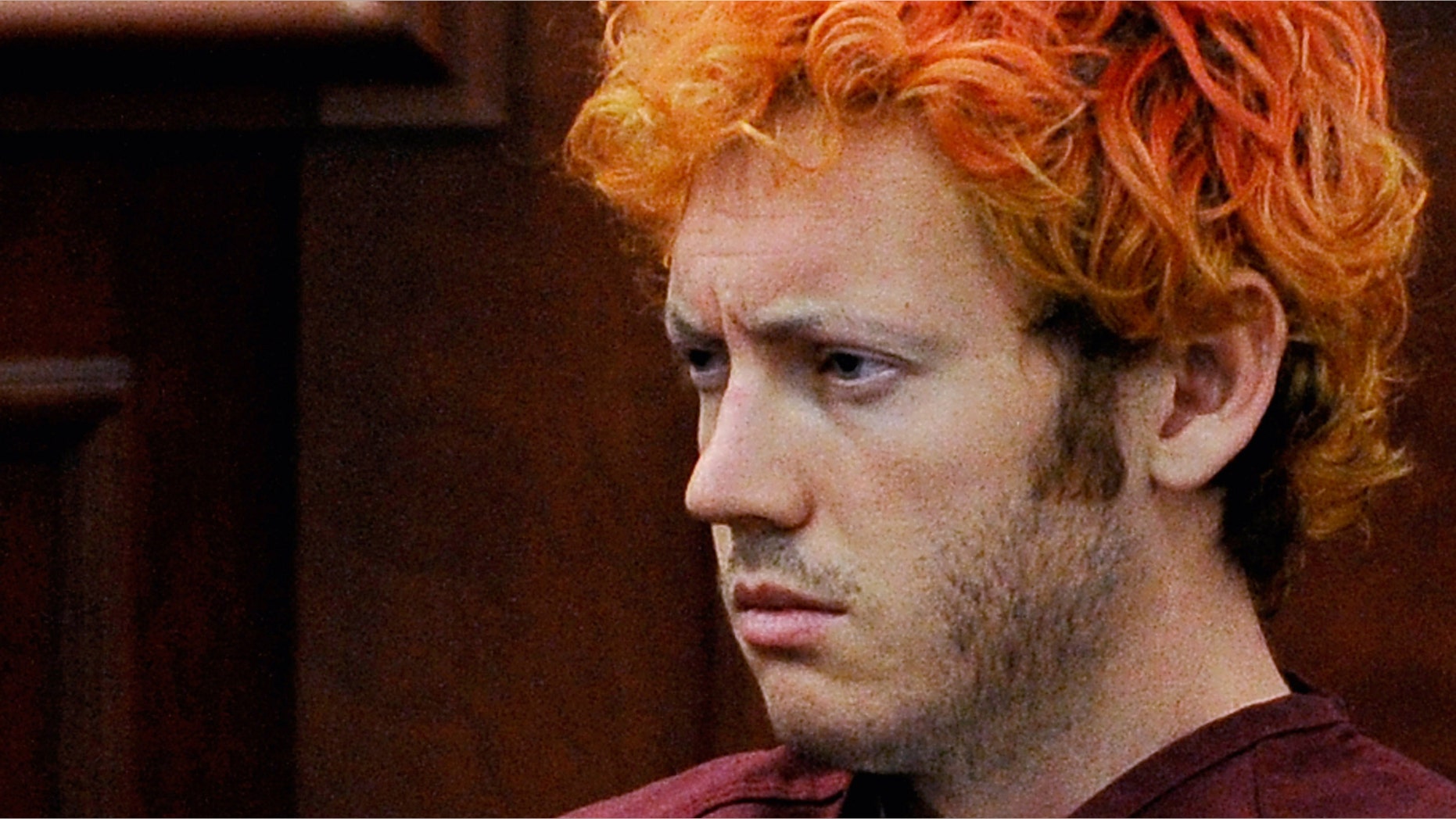 CENTENNIAL, CO - JULY 23: Accused movie theater shooter James Holmes makes his first court appearance at the Arapahoe County on July 23, 2012 in Centennial, Colorado. According to police, Holmes killed 12 people and injured 58 others during a shooting rampage at an opening night screening of "The Dark Knight Rises" July 20, in Aurora, Colorado. (Photo by RJ Sangosti-Pool/Getty Images)