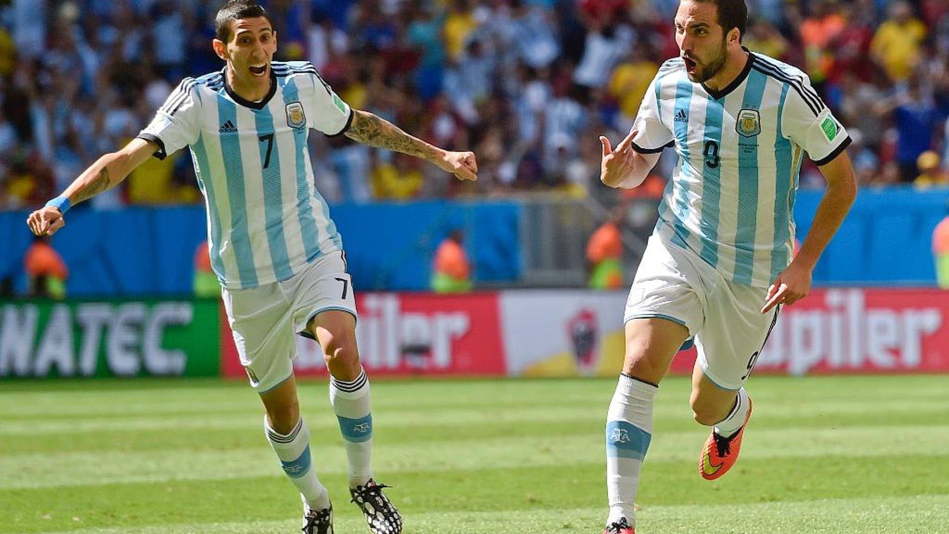 Argentina's Gonzalo Higuain, right, celebrates with Angel di Maria after scoring the opening goal during the World Cup quarterfinal soccer match between Argentina and Belgium at the Estadio Nacional in Brasilia, Brazil, Saturday, July 5, 2014. (AP Photo/Martin Meissner)