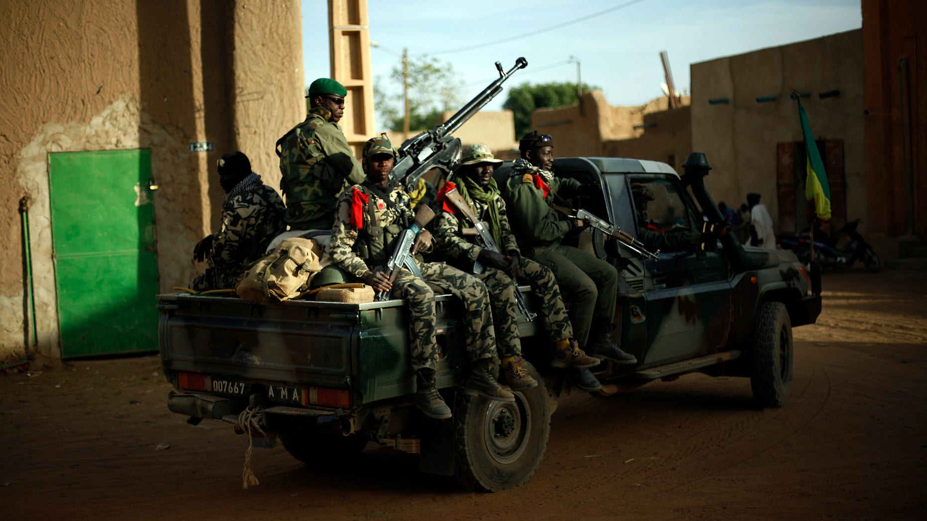 Malian soldiers patrol the streets of Gao, northern Mali, Tuesday Feb. 5, 2013. Troops from France and Chad moved into Kidal in an effort to secure the strategic north Malian city, a French official said Tuesday, as the international force put further pressure on the Islamic extremists to push them out of their last major bastion of control in the north.(AP Photo/Jerome Delay)