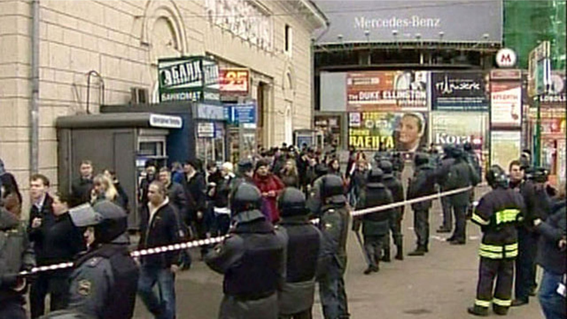Police outside Park Kultury subway station after bomb blast, Moscow, Russia.