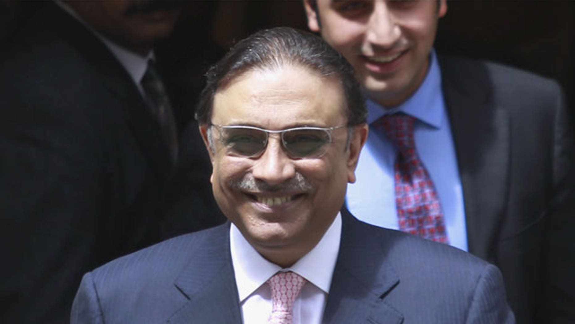 In this Friday, July 1, 2011 file photo, Pakistan's President Asif Ali Zardari, followed by his son Bilawal Bhutto Zardari, chairman of the Pakistan Peoples Party, exits after his meeting with Britain's Prime Minister David Cameron at his official residence at 10 Downing Street in central London.