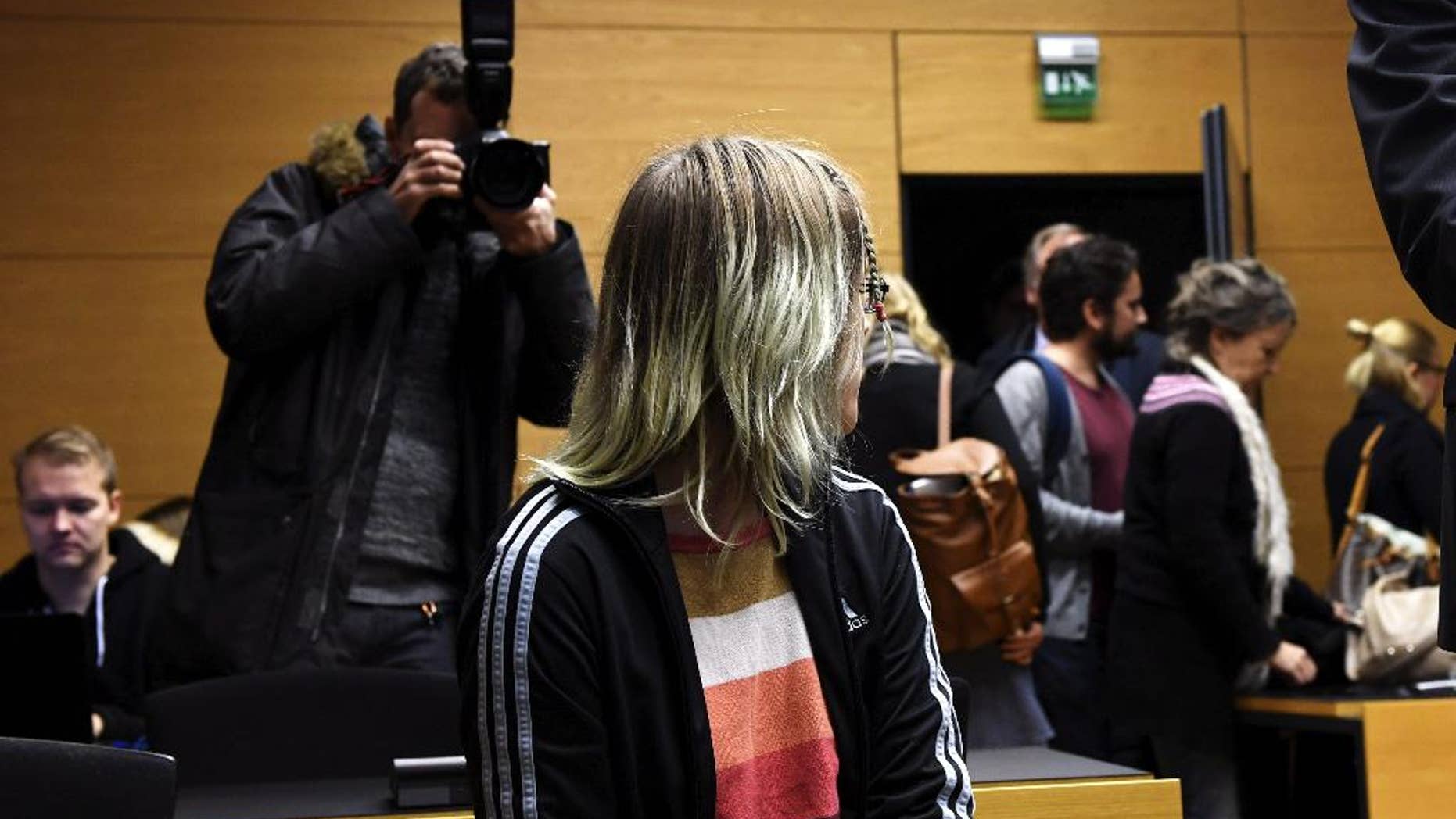 An unidentified 21-year-old Finnish woman is pictured at the Helsinki District Court on Friday Nov. 11, 2016. Prosecutors said the woman a former student was planning a school shooting in central Finland that would kill at least 40 students.(Vesa Moilanen, Lehtikuva via AP)