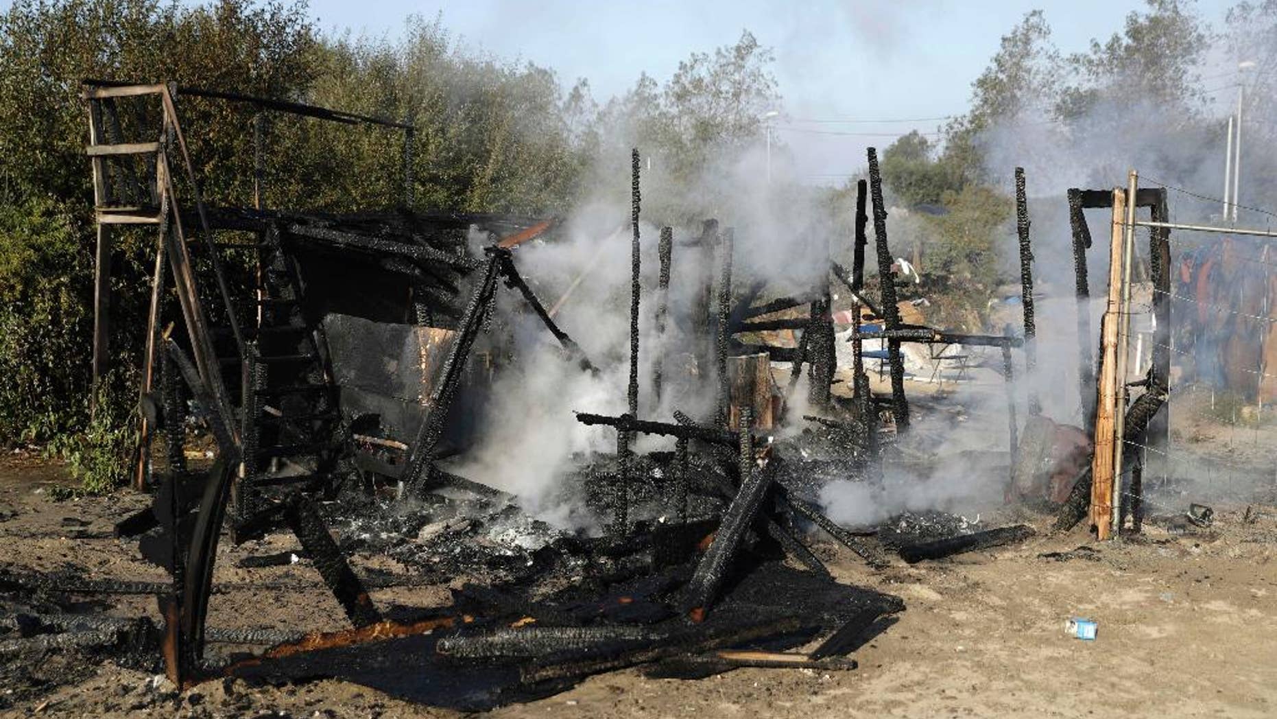 The remains of a shelter that was set on fire Tuesday at the refugee camp known as "The Jungle."