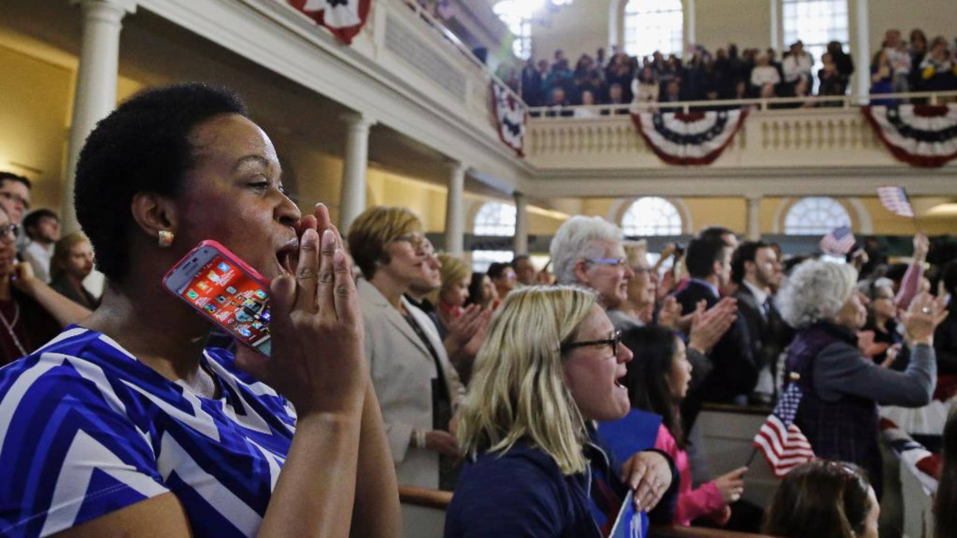 FILE- In this Feb. 29, 2016, file photo, supporters cheer Democratic presidential candidate Hillary Clinton as she speaks during a campaign event at the Old South Meeting House in Boston. The meeting house where colonists gathered to begin challenging British rule before the American Revolution and launched the Boston Tea Party has reopened. (AP Photo/Elise Amendola, File)