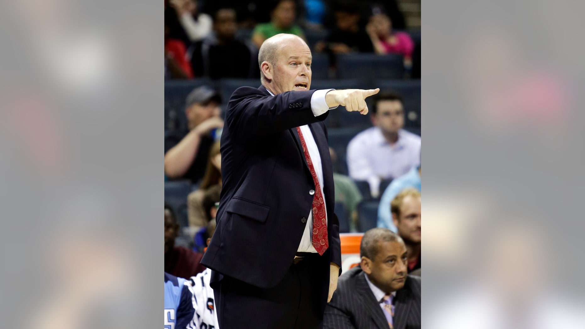 Charlotte Bobcats coach Steve Clifford directs his team as they play the Toronto Raptors in the second half of an NBA basketball game in Charlotte, N.C., Wednesday, Nov. 6, 2013. Charlotte won 92-90. (AP Photo/Nell Redmond)