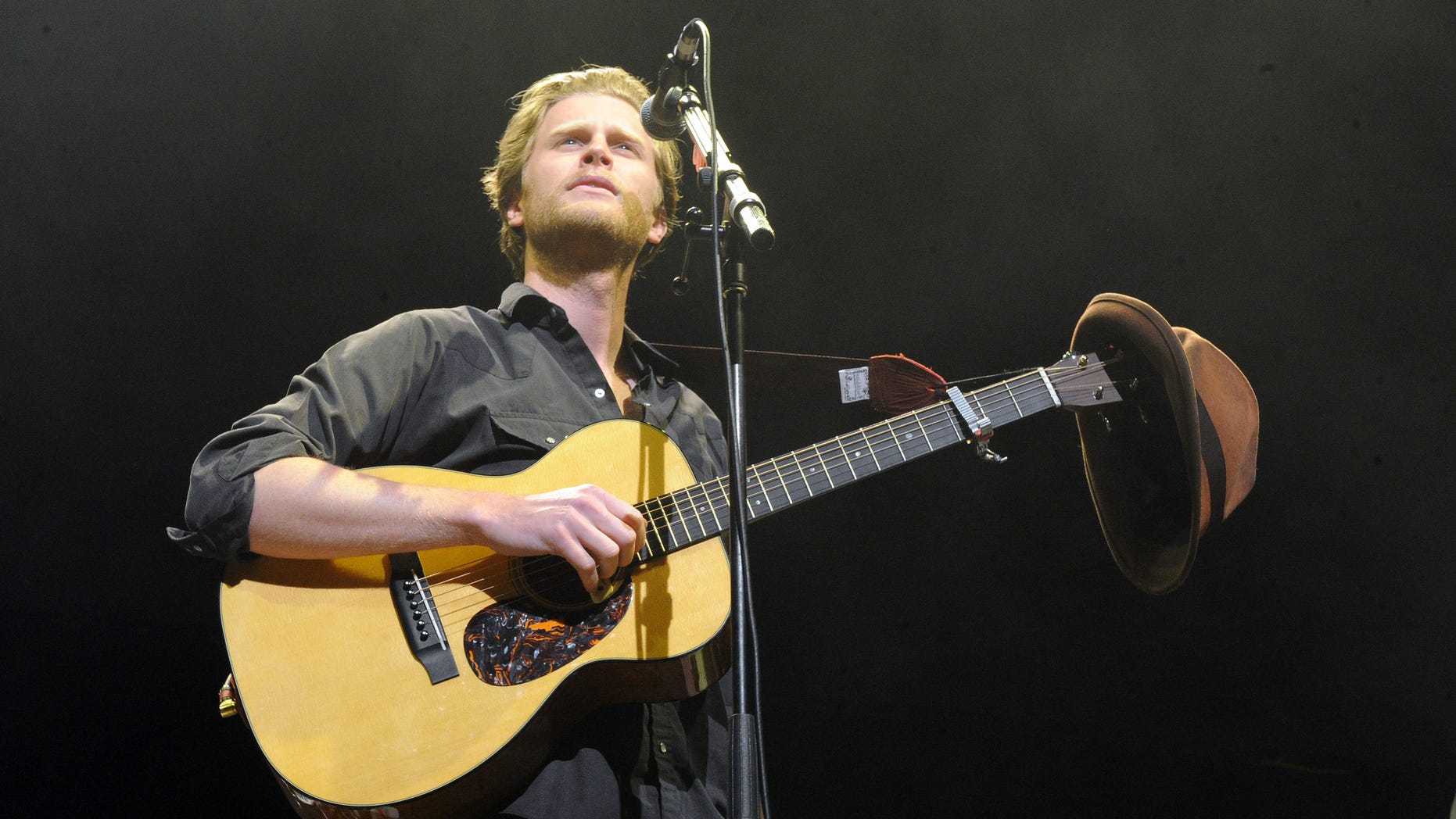 FILE - In this Dec. 8, 2012 file photo, Wesley Schultz of The Lumineers performs at KROQ Almost Acoustic Christmas in Los Angeles. The Lumineers' “Ho Hey” was the top streamed track on Spotify for the week of Dec. 10. (Photo by Katy Winn/Invision/AP, File)