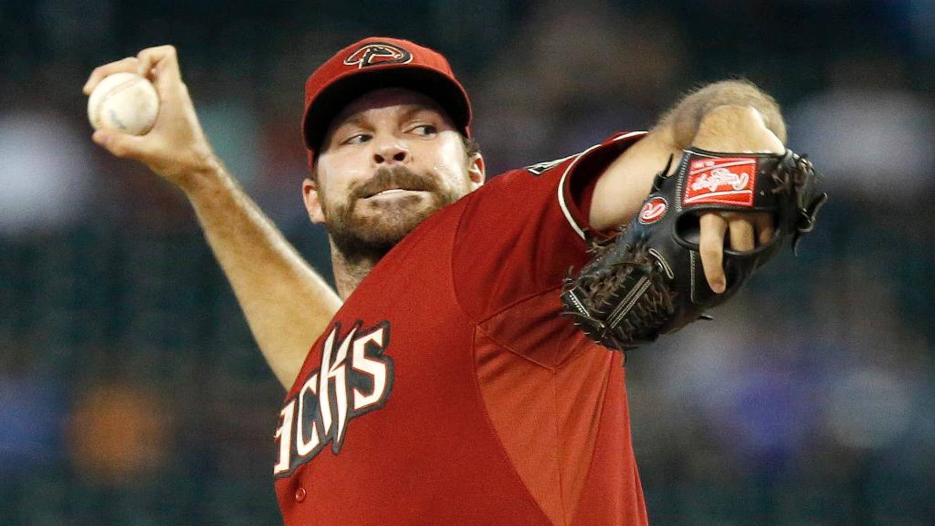 Arizona Diamondbacks' Josh Collmenter throws a pitch against the Kansas City Royals during the first inning of a baseball game on Wednesday, Aug. 6, 2014, in Phoenix. (AP Photo/Ross D. Franklin)