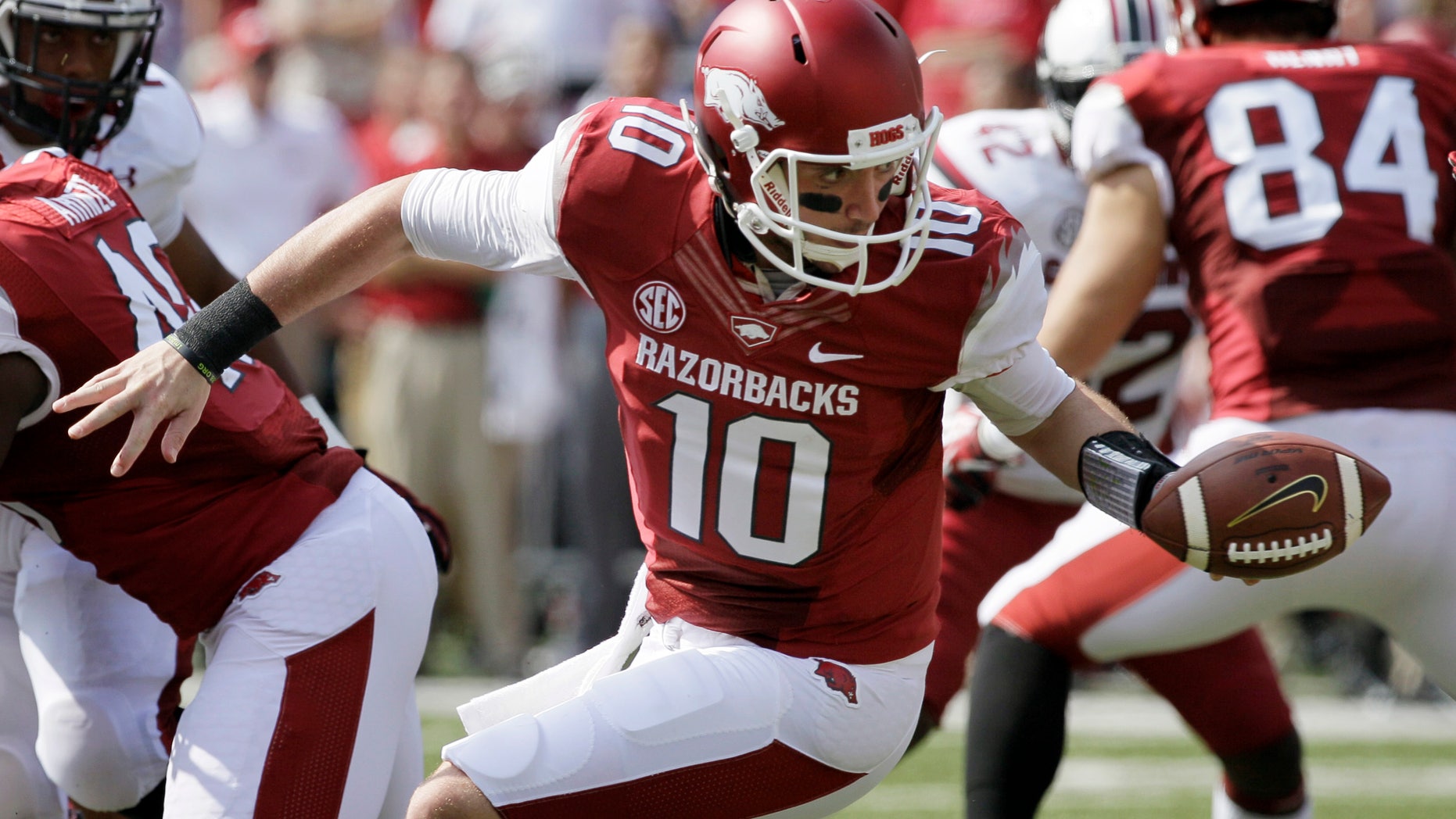 FILE - In this Oct. 12, 2013, file photo, Arkansas quarterback Brandon Allen (10) hands off during the second quarter of an NCAA college football game against South Carolina in Fayetteville, Ark. Allen is still looking for that signature game as the starting quarterback at Arkansas, especially after last week's 30-yard passing performance in a loss to South Carolina. (AP Photo/Danny Johnston, File)