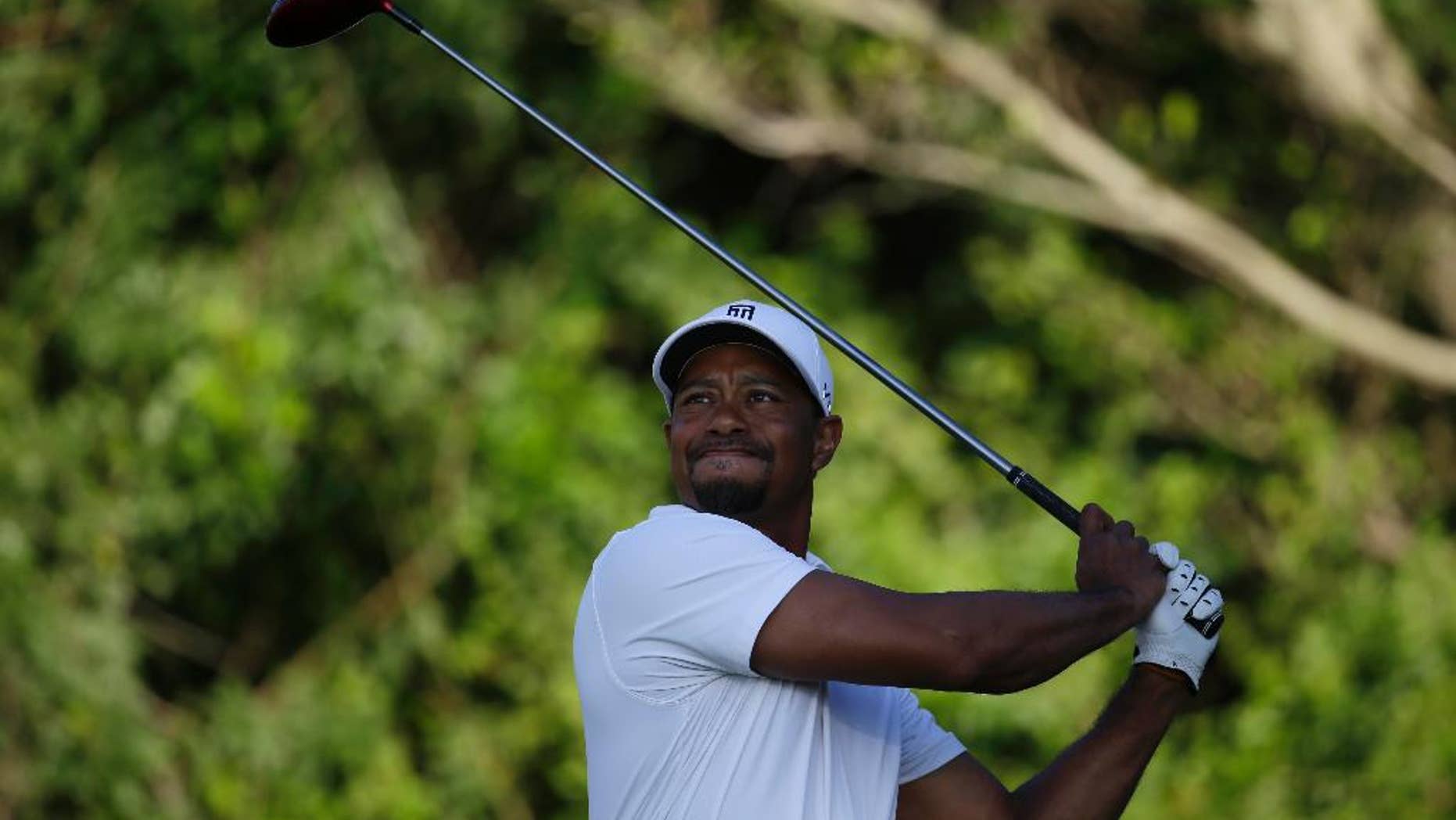 Tiger Woods tees off on the third hole during the third round of the Honda Classic golf tournament, Saturday, March 1, 2014, in Palm Beach Gardens, Fla. (AP Photo/Lynne Sladky)