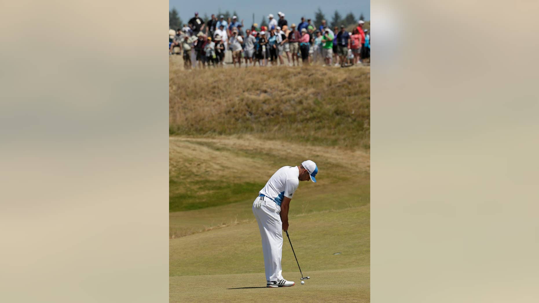 Sergio Garcia, of Spain, putts on the 17th hole during a practice round for the U.S. Open golf tournament at Chambers Bay on Wednesday, June 17, 2015 in University Place, Wash. (AP Photo/Charlie Riedel)