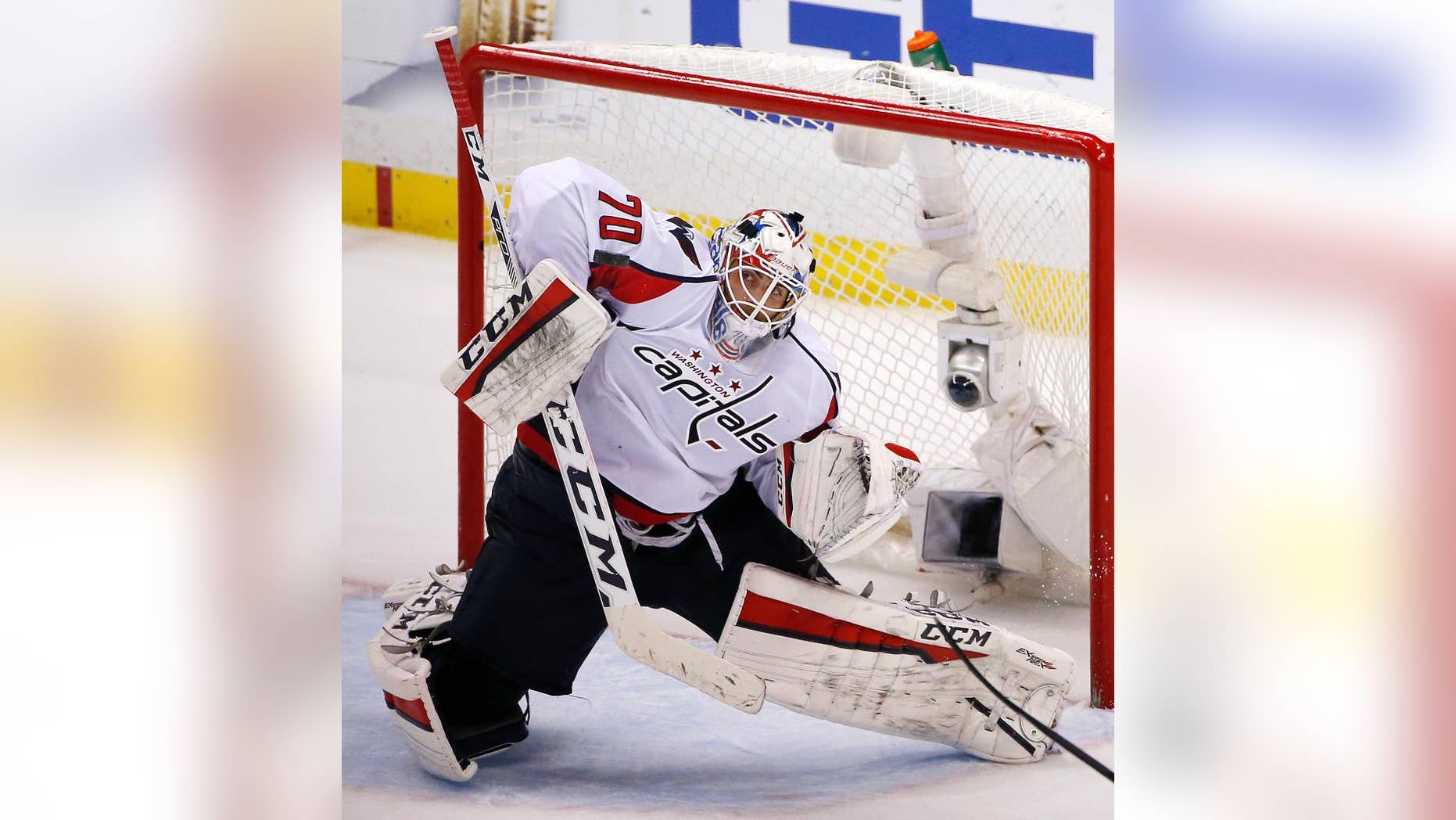 FILE - In this May 10, 2016 file photo, Washington Capitals goalie Braden Holtby blocks a shot during the third period of Game 6 in an NHL hockey Stanley Cup Eastern Conference semifinals against the Pittsburgh Penguins in Pittsburgh. Vezina Trophy finalist Holtby will represent the Washington Capitals in the annual Capital Pride Parade on Saturday, June 11, 2016, which the goaltender hopes is just the start of his involvement in the pro-gay-rights movement. (AP Photo/Gene J. Puskar, File)