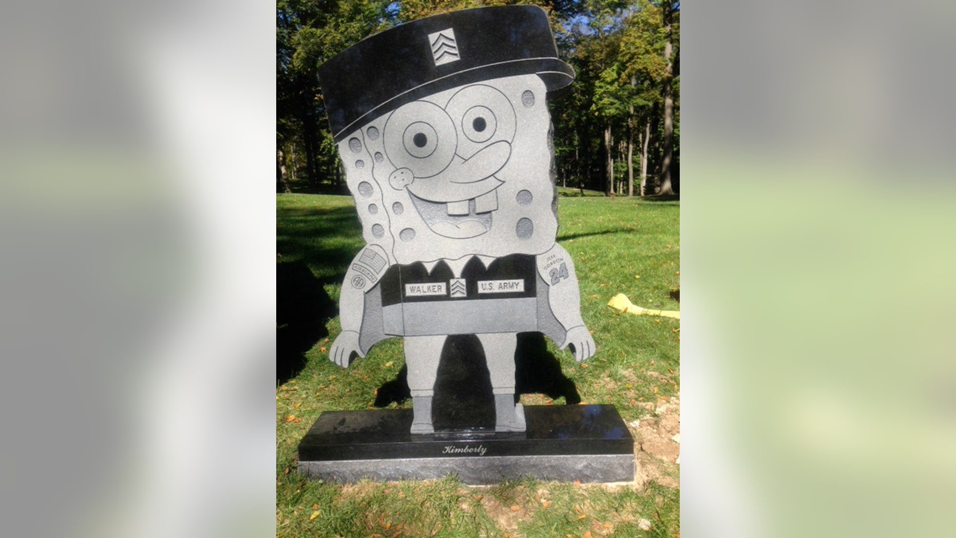 In this Thursday, Oct. 10, 2013, photo provided by the family of Kimberly Walker, shows Walker's gravestone in the likeness of popular cartoon character SpongeBob SquarePants. Despite getting prior approval for the gravestone from Spring Grove Cemetery in Cincinnati, the cemetery recently removed it, saying it did not fit in with the character of the historic and picturesque cemetery. (AP Photo/Kara Walker)