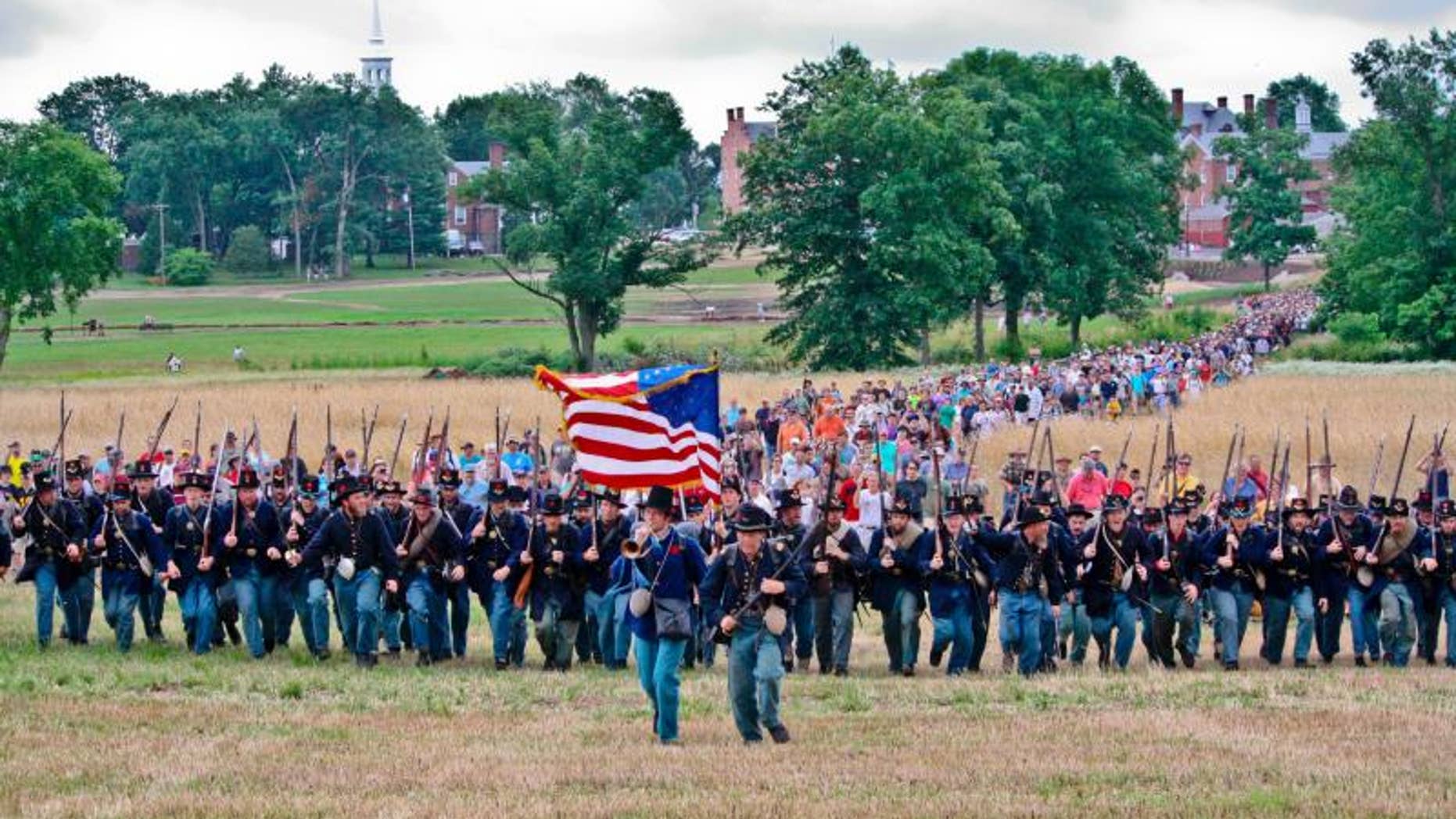 The Iron Brigade charges up McPherson's Ridge during the 150th Anniversary of the Battle of Gettysburg on July 1, 2013.