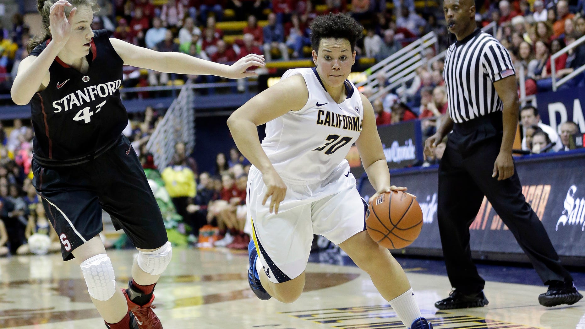 In this photo taken on Feb. 2, 2013, California guard Mikayla Lyles (30) dribbles past Stanford forward Bonnie Samuelson during the second half on an NCAA college basketball game in Berkeley, Calif. Lyles moved into the starting lineup for the first time in her four-year California career during a pair of games against rival Stanford last week, and did everything to show she belongs by knocking down clutch shots and making key hustle plays. (AP Photo/Marcio Jose Sanchez)
