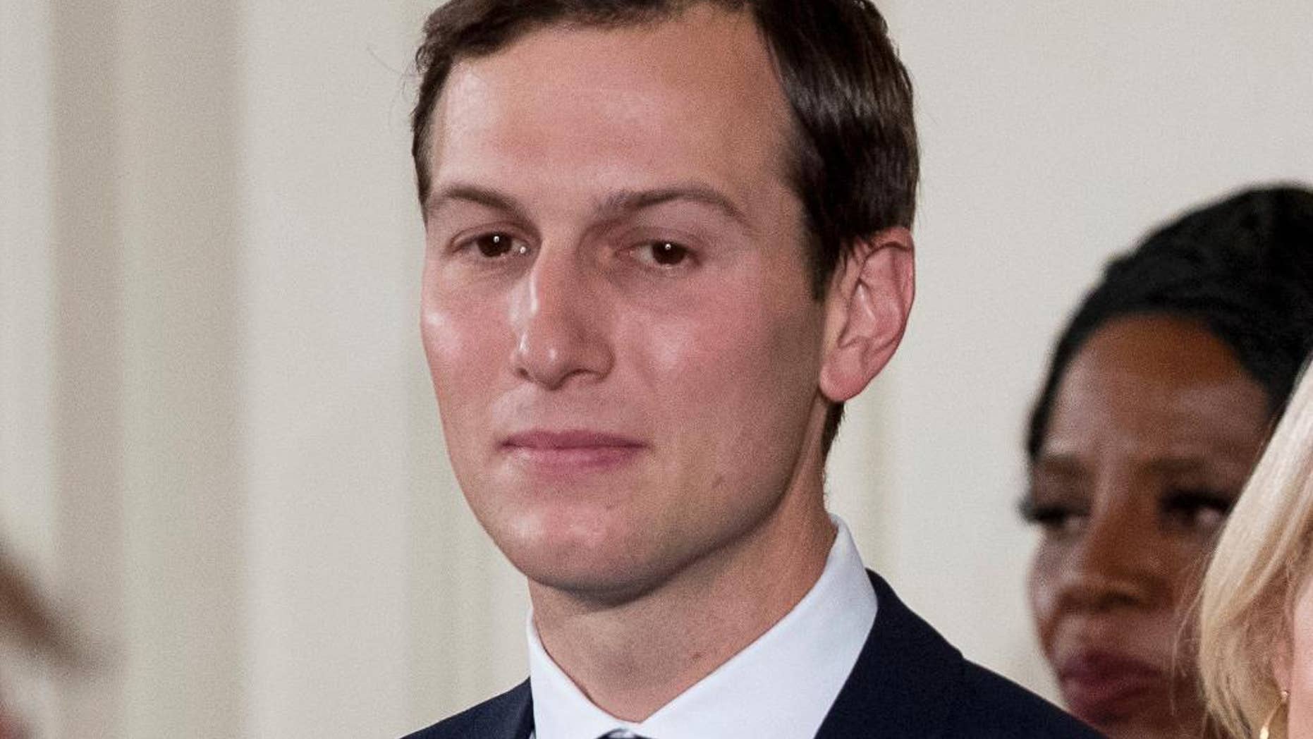 FILE- In this Jan. 22, 2017, file photo, President Donald Trump's White House Senior Adviser Jared Kushner watches as President Donald Trump, left, congratulates other White House senior staff during a swearing in ceremony in the East Room of the White House in Washington. Their reputations at risk, a coterie of President Donald Trump's associates caught up in the swirling debate about Trump and Russia are turning to a similar if unusual playbook: volunteering to testify to Congress, before even being asked. Kushner, told the Senate intelligence panel he'd gladly answer questions about his meetings with the Russian ambassador and others. (AP Photo/Andrew Harnik, File)