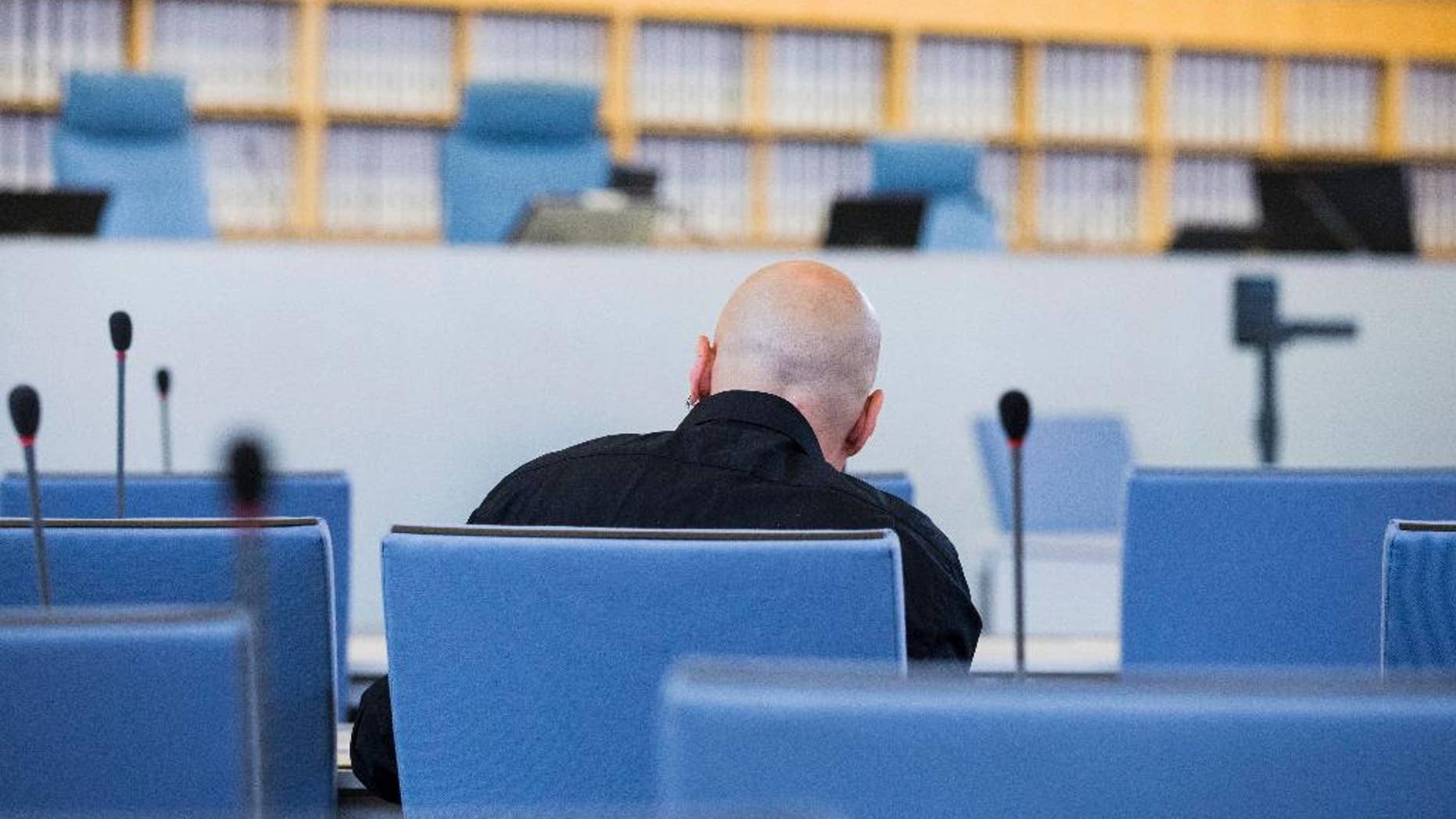 FILE - In this June 22, 2016 file picture accused Frank S. sits in a courtroom of the higher regional court in Duesseldorf, Germany. A German federal court has rejected an appeal Monday Jan. 9, 2017 by a far-right extremist sentenced to 14 years in prison for the attempted murder of a politician who is now Cologne’s mayor. The defendant, identified only as Frank S. in line with German privacy rules, was convicted by a Duesseldorf court in July. Henriette Reker, who was in charge of housing refugees in Cologne at the time, was stabbed in the neck Oct. 17, 2015 as she campaigned. (Rolf Vennenbernd/dpa via AP, file)