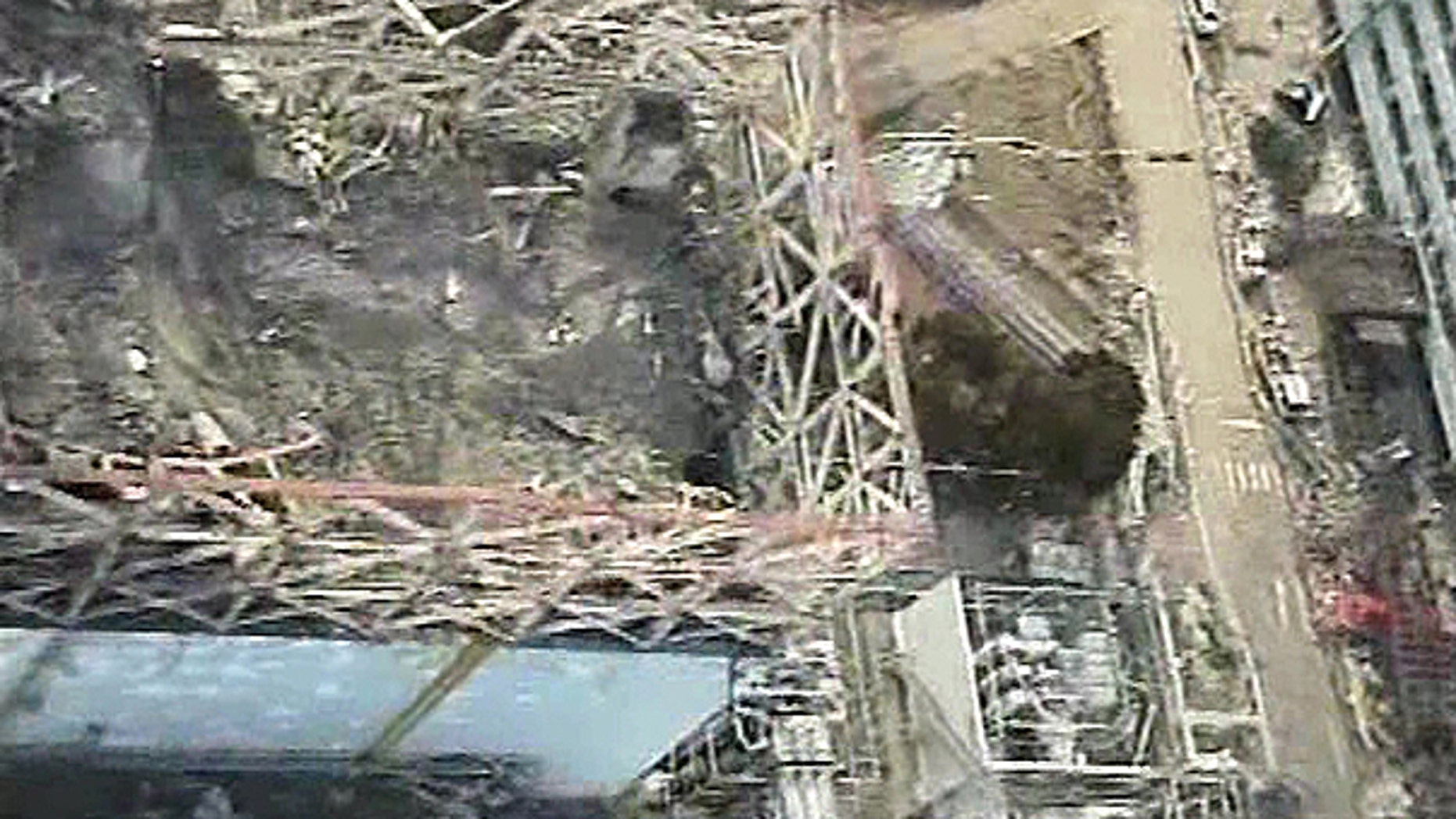 April 10: Image taken by T-Hawk drone aircraft and released by Tokyo Electric Power Co. (TEPCO) shows the damaged reactor building of Unit 1 of the tsunami-crippled Fukushima Dai-ichi nuclear power plant in Okuma, Fukushima Prefecture, northeastern Japan.