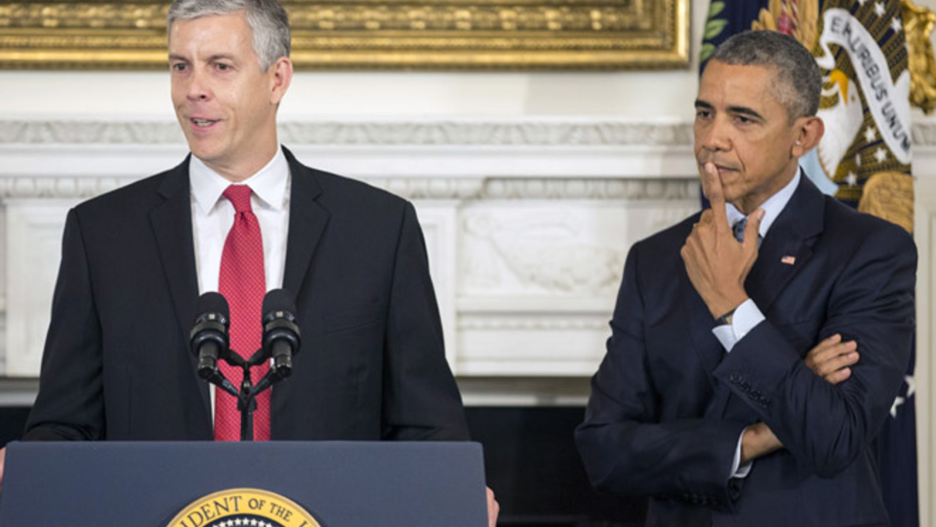 October 2, 2015: U.S. President Barack Obama listens as U.S. Secretary of Education Arne Duncan announces his resignation in the State Dinning Room of the White House in Washington.
