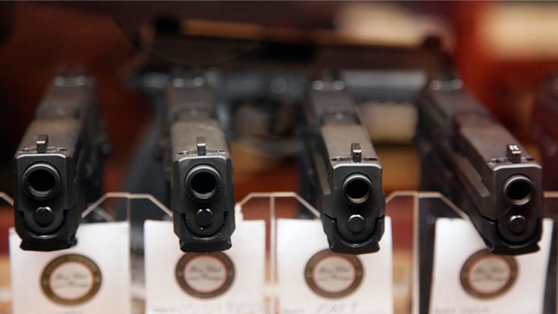 FILE: Handguns are displayed.