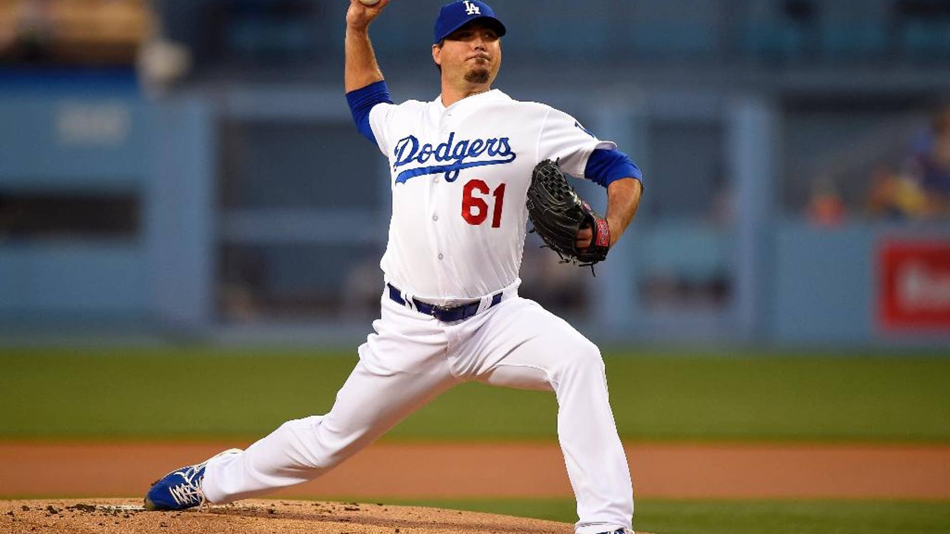 Los Angeles Dodgers starting pitcher Josh Beckett throws to the plate during the first inning of a baseball game against the Detroit Tigers, Wednesday, April 9, 2014, in Los Angeles. (AP Photo/Mark J. Terrill)
