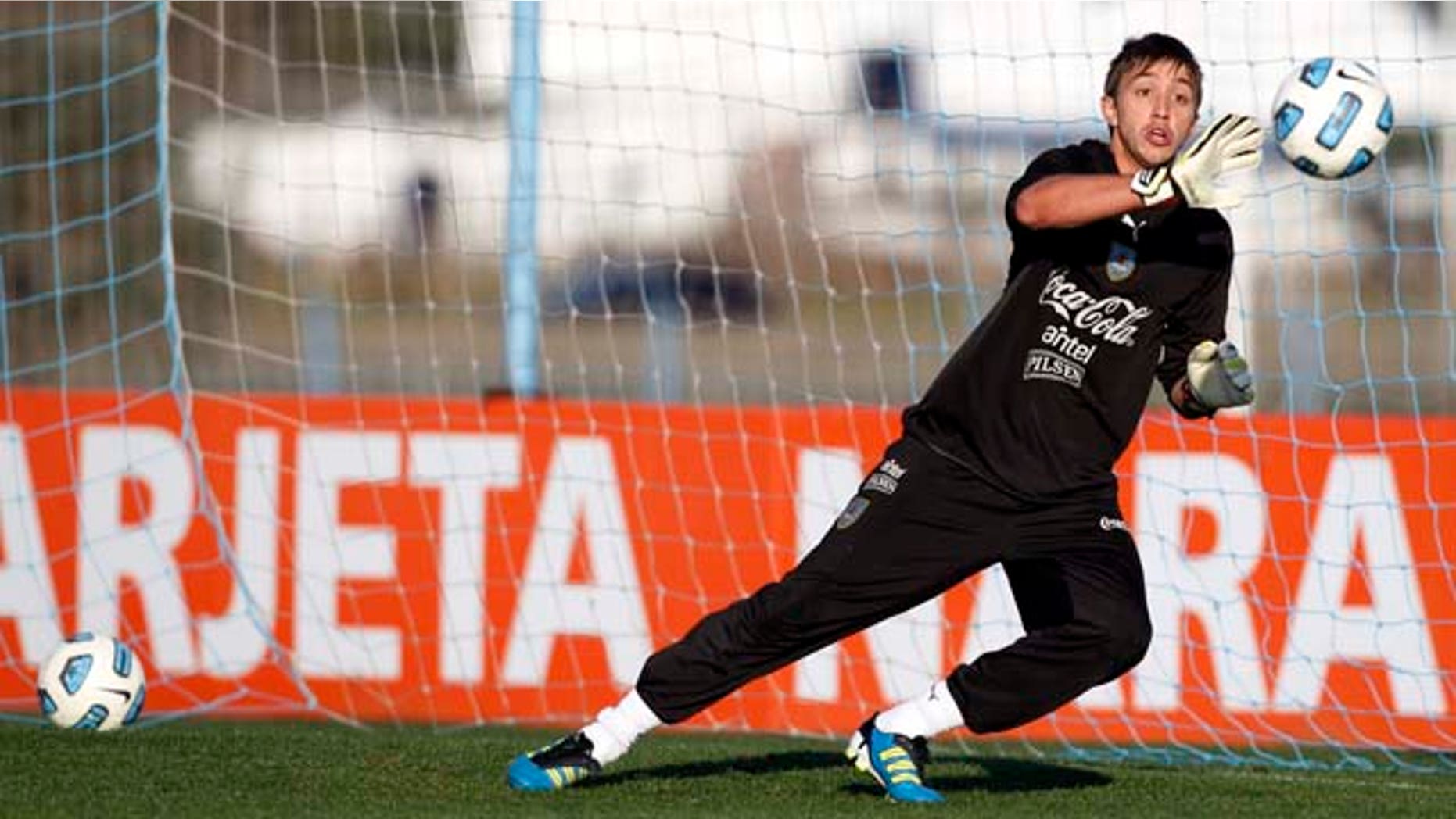 Uruguay's goalkeeper Fernando Muslera attends a training session in Buenos Aires, Argentina, Thursday, July 21, 2011. Uruguay will face Paraguay on July 24 for the final Copa America soccer match. (AP Photo/Natacha Pisarenko)