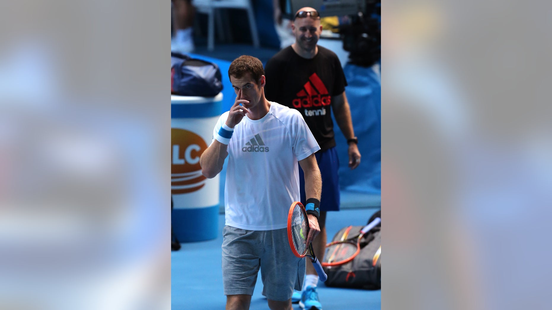 Andy Murray of Britain prepares for a training session on the Rod Laver Arena, at the Australian Open tennis championship in Melbourne, Australia, Tuesday, Jan. 21, 2014. Wimbledon champion Murray faces Roger Federer, winner of 17 Grand Slams, at the Australian Open quarterfinal Wednesday.(AP Photo/Shuji Kajiyama)