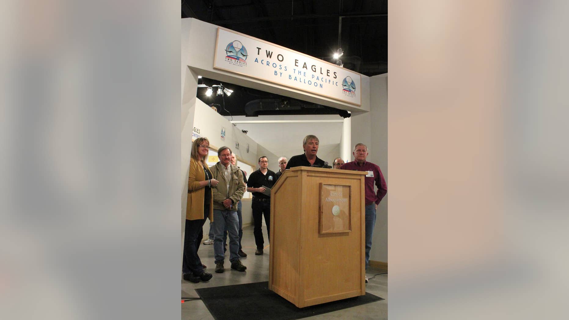 Two Eagles balloon mission control director Steve Shope, at podium, discusses their balloon record breaking attempt during a briefing in Albuquerque, N.M., on Thursday, Jan. 29, 2015. The Two Eagles balloon pilots, Troy Bradley and Leonid Tiukhtyaev were crossing over the Pacific Ocean on Thursday as part of their record breaking challenge. (AP Photo/Susan Montoya Bryan)