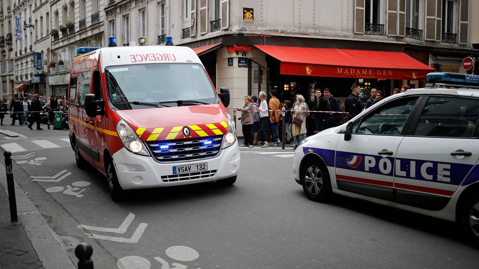 Emergency services arrive at the scene of a hostage situation in central France on Tuesday, June 12, 2018.