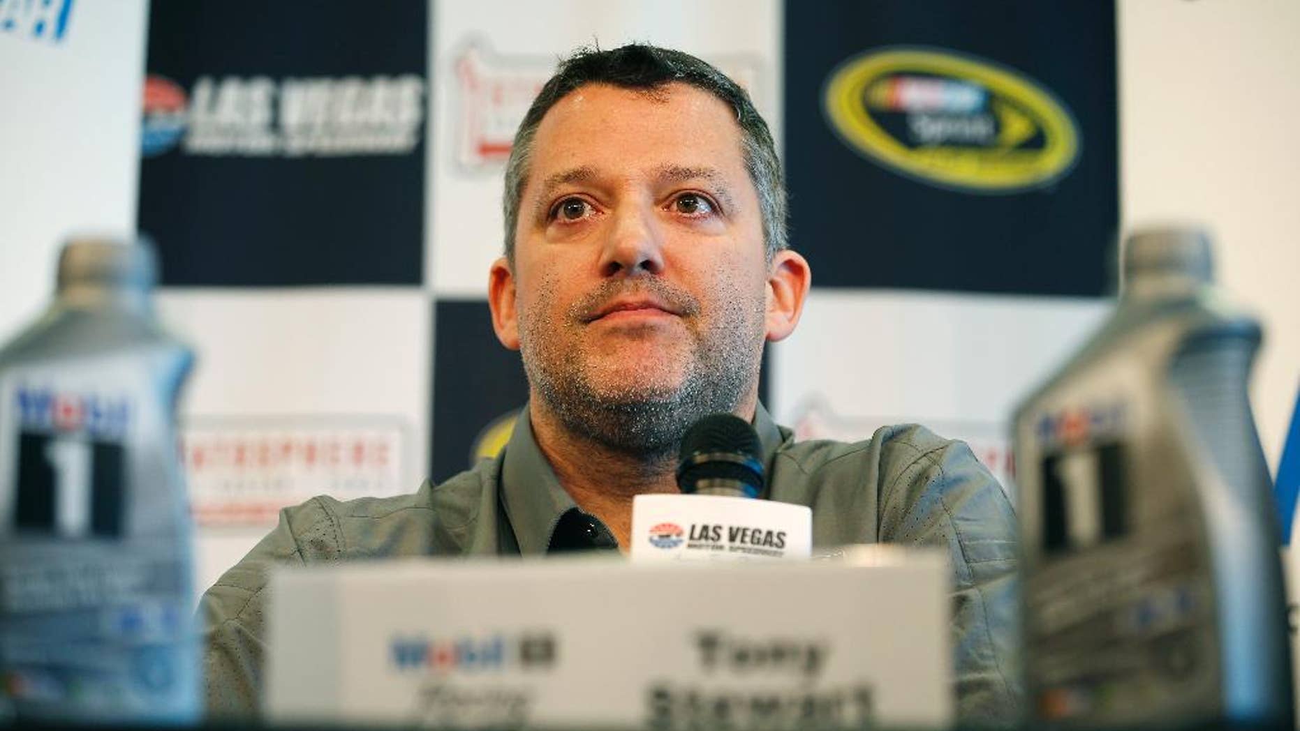 FILE - In this March 4, 2016, file photo, NASCAR driver Tony Stewart speaks during a news conference in Las Vegas. Stewart has been cleared to return to racing and will be back in his car Friday, April 22, 2016, at Richmond International Raceway. The three-time NASCAR champion missed the first eight races of the season with a fractured vertebra suffered in a January all-terrain vehicle accident. (AP Photo/John Locher, File)