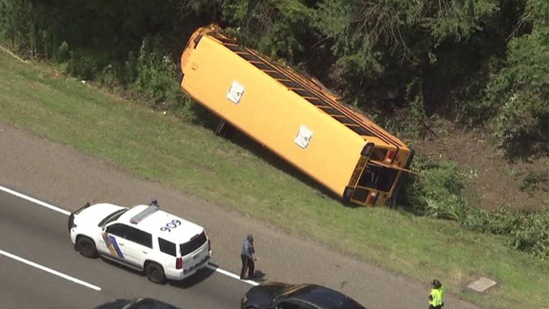 A school bus flipped on its side in Cherry Hill, N.J.