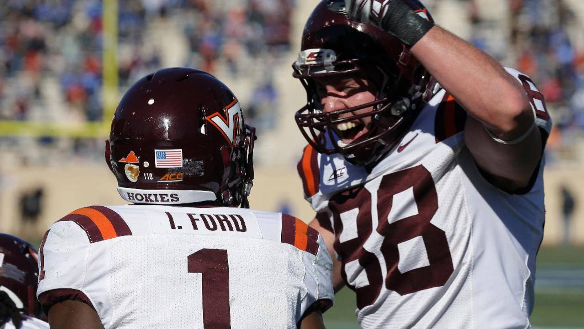 Virginia Tech's Isaiah Ford (1) and Ryan Malleck (88) celebrate Ford's touchdown against Duke during the first half of an NCAA college football game in Durham, N.C., Saturday, Nov. 15, 2014. Virginia Tech won 17-16. (AP Photo/Gerry Broome)