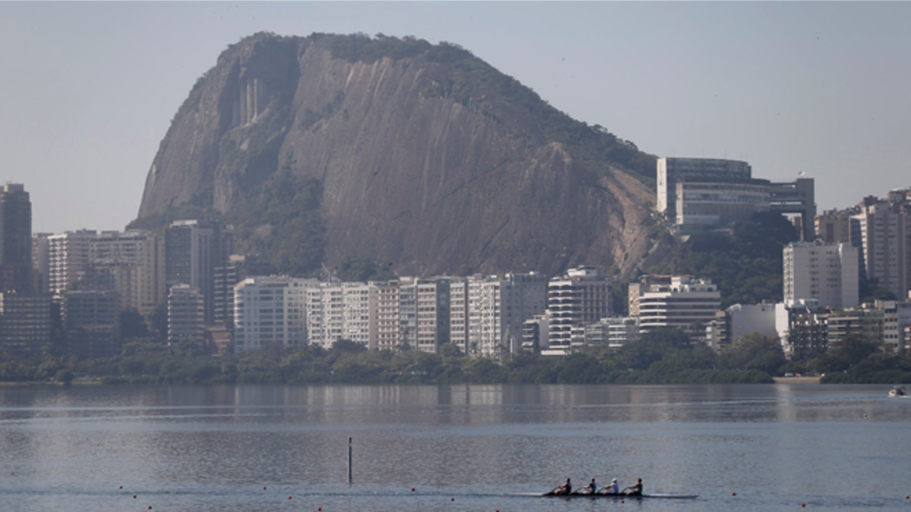 Rowers practice for the 2015 World Rowing Junior Championships on Rodrigo de Freitas lake in Rio de Janeiro, Brazil, Tuesday, Aug. 4, 2015. The head of the governing body of world rowing says he will ask for viral testing at the rowing venue for next year's Rio Olympics, and says he expects all other water sports in Rio to follow suit. The move comes after an Associated Press investigation last week showed a serious health risk to Olympic athletes who will compete at water venues around Rio that are rife with human waste and sewage. (AP Photo/Silvia Izquierdo)