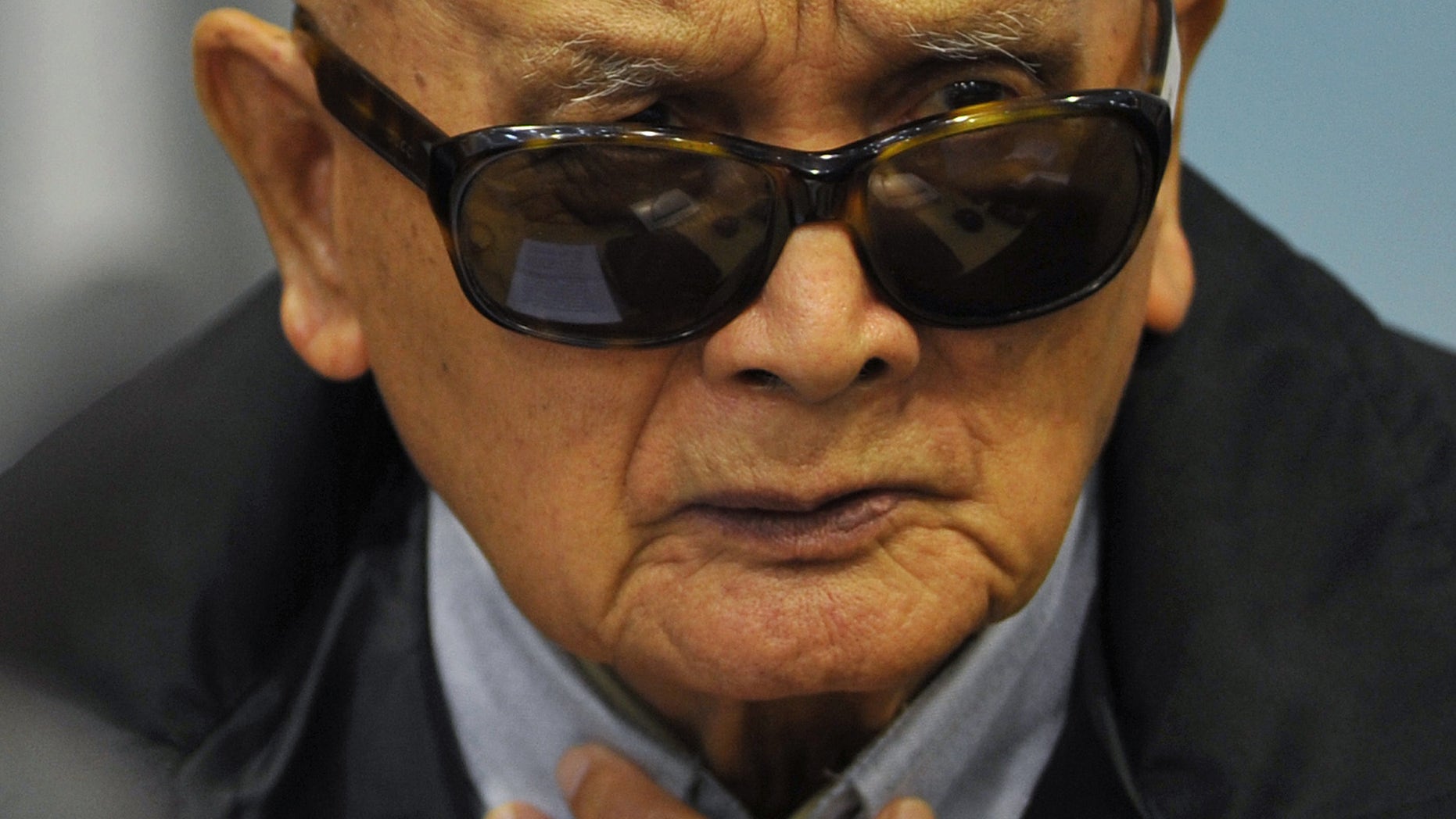 FILE - In this Aug. 29, 2011 file photo released by Extraordinary Chambers in the Courts of Cambodia, Nuon Chea, who was Pol Pot's No. 2 and the group's chief ideologist, sits in the court room of the U.N.-backed war crimes tribunal during a hearing in Phnom Penh. Cambodia's Khmer Rouge tribunal began hearing closing statements Wednesday, Oct. 16, 2013 in its first trial of top leaders of the 1970s communist regime widely considered responsible for the deaths of an estimated 1.7 million people. Nuon Chea and Khieu Samphan, its head of state, are charged with genocide and crimes against humanity — including torture, enslavement and murder — for planning and implementing the group's brutal policies. (AP Photo/Extraordinary Chambers in the Courts of Cambodia, Mark Peters, File) EDITORIAL USE ONLY