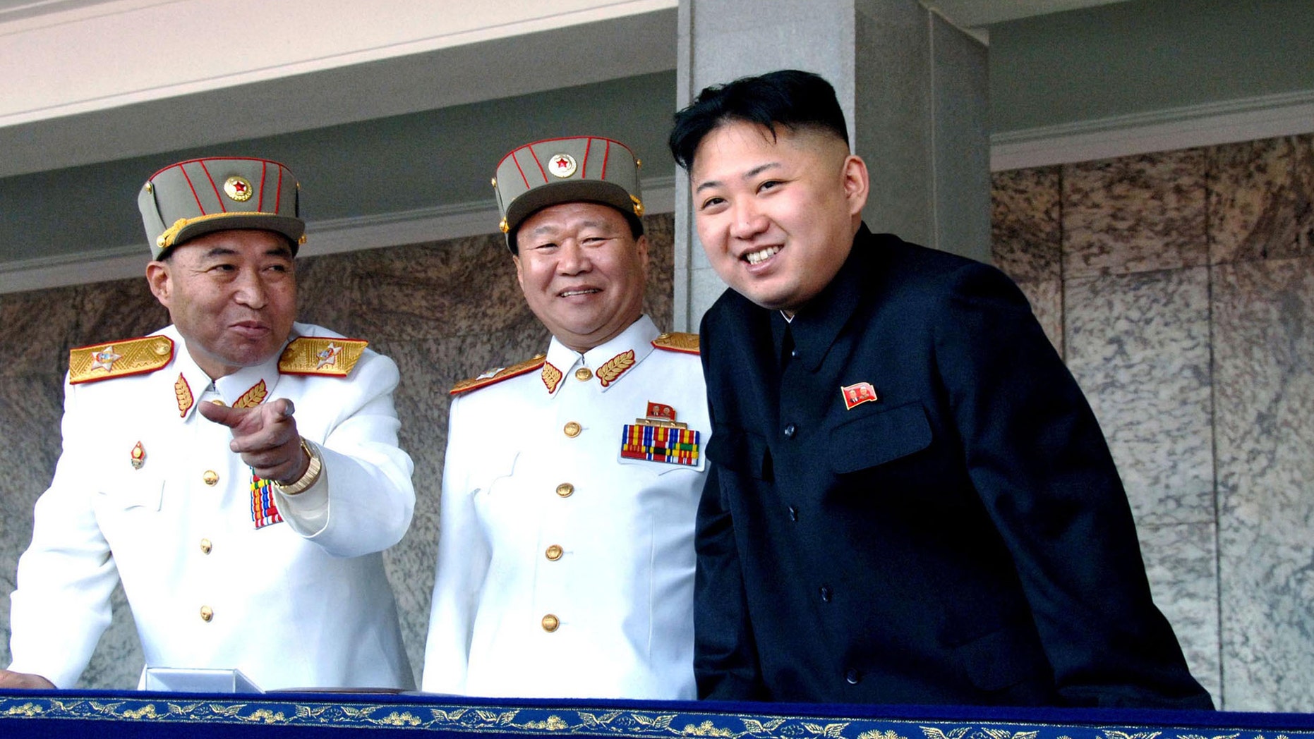 FILE: Undated: North Korean leader Kim Jong Un, (r.), with the Korean People's Army senior officers, preparing a satellite launch.