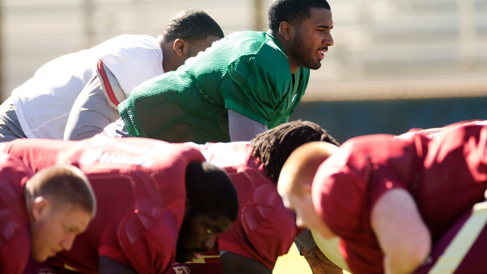 Florida State quarterback EJ Manuel runs drills during practice, Thursday, Dec. 27, 2012, in Davie, Fla. Florida State is scheduled to play Northern Illinois in the Orange Bowl NCAA college football game on Tuesday, Jan. 1, 2013. (AP Photo/J Pat Carter)