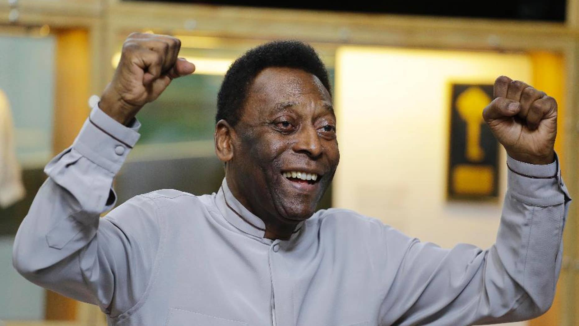 FILE - In this June 15, 2014 file photo, soccer great Pele poses for photos during the inauguration of the Pele Museum, in Santos, Brazil. Soccer great Pele isn't showing signs of the urinary tract infection that prompted his hospitalization and doctors said they will suspend kidney treatment. The Albert Einstein hospital in Sao Paulo said Saturday, Nov. 29, 2014, that the 74-year-old Pele remains in an intensive care unit, but his condition was constantly improving. (AP Photo/Nelson Antoine, File)