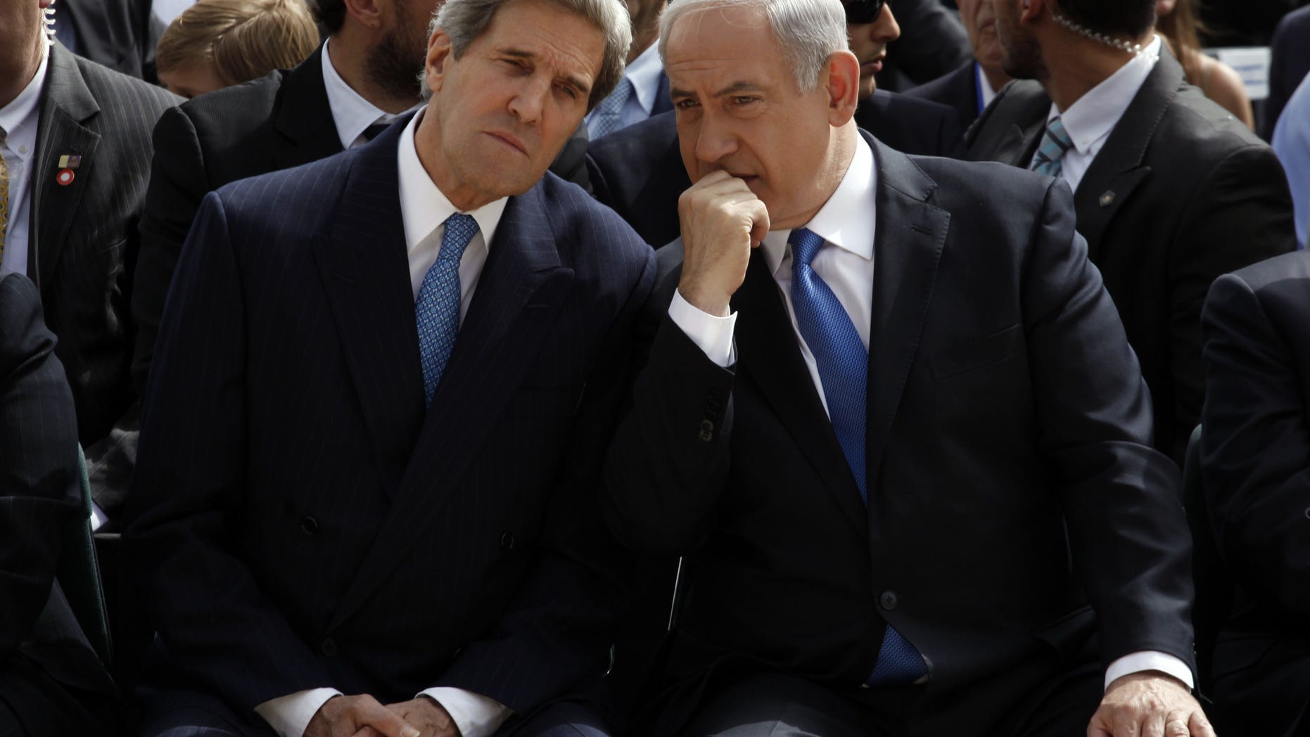 FILE - In this Monday, April 8, 2013 file photo, Israeli Prime Minister Benjamin Netanyahu, right, speaks with U.S. Secretary of State John Kerry during the annual ceremony marking Holocaust Remembrance Day at the Yad Vashem memorial in Jerusalem. On the surface, the Arab League’s new peace initiative offers Israel everything it ever dreamed of _ normal relations with an entire region that has long objected to the very existence of the Jewish state, and even the chance to keep some war-won land. But two weeks after Secretary of State John Kerry persuaded Arab leaders to reissue their 2002 offer with new incentives, Israel is maintaining a striking silence and critics are accusing Prime Minister Benjamin Netanyahu of tragically missing a historic opportunity. (AP Photo/Gali Tibbon, Pool)