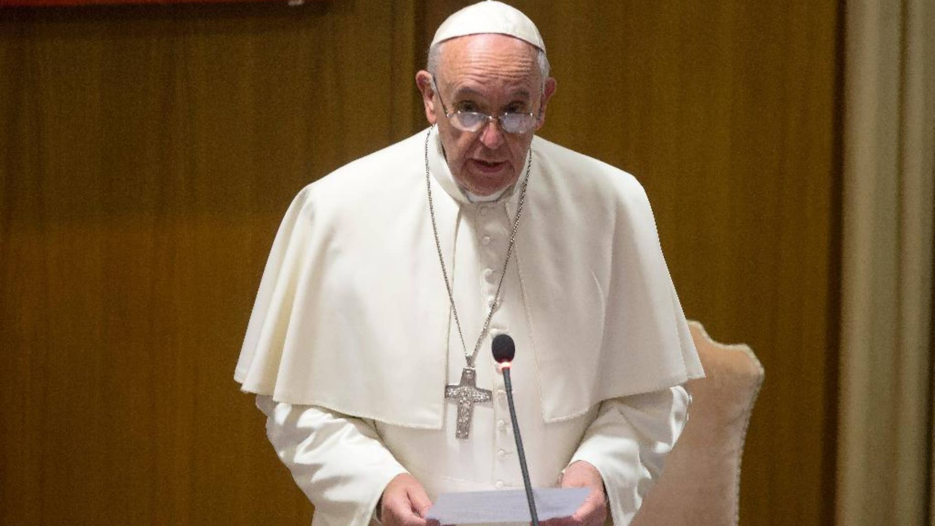Pope Francis delivers a speech before the start of the morning session of the Synod of bishops, at the Vatican, Friday, Oct. 9, 2015. (AP Photo/Alessandra Tarantino)