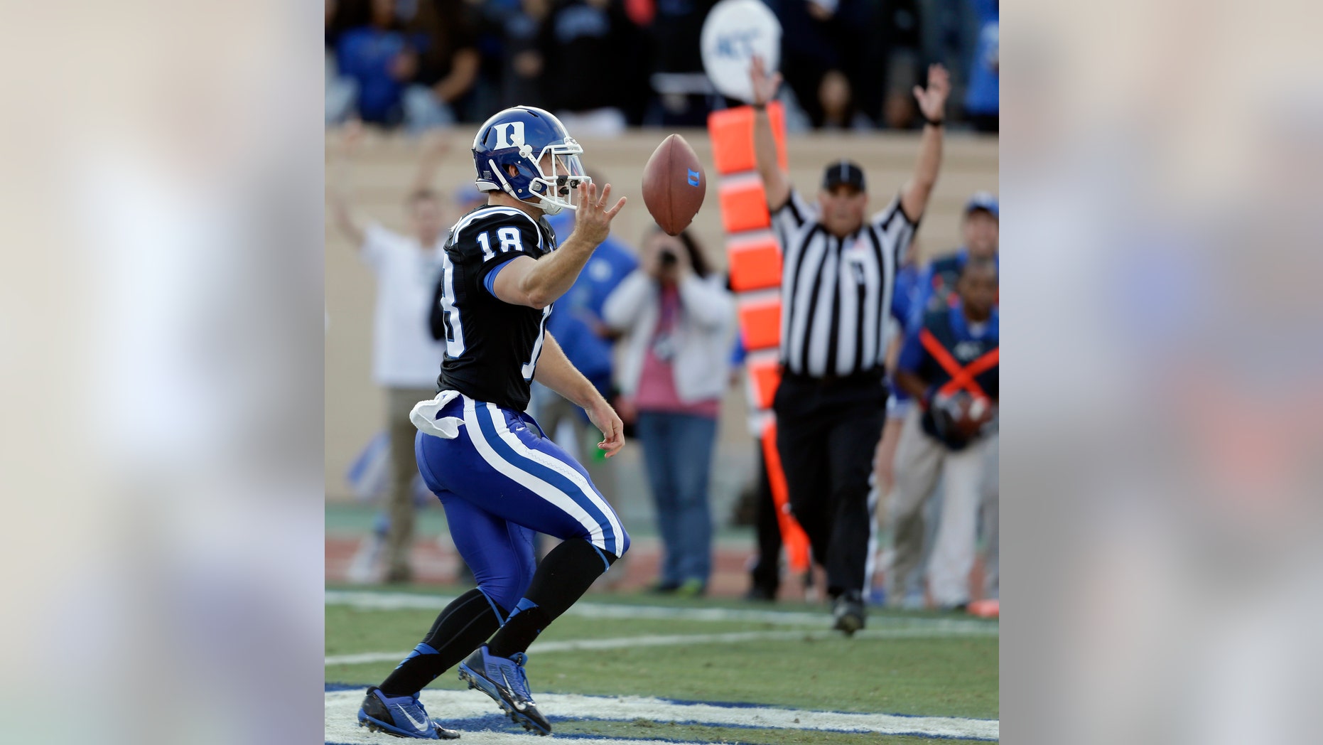 Duke quarterback Brandon Connette runs the ball into the end zone for a touchdown during the first half of an NCAA college football game against Miami in Durham, N.C., Saturday, Nov. 16, 2013. (AP Photo/Gerry Broome)