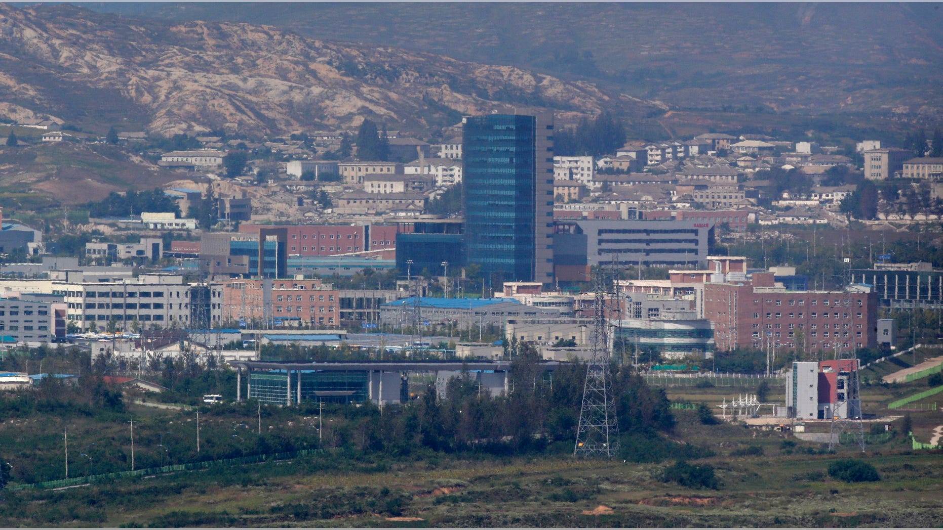 FILE - This Sept. 25, 2013 file photo shows the Kaesong industrial complex, whish is seen from the Dora Observation Post in Paju near the border village of Panmunjom, which has separated the two Koreas since the Korean War, in Paju, north of Seoul, South Korea. South Korean lawmakers will tour the jointly-run factory park in North Korea next week, officials said Thursday, Oct. 24, 2013. Pyongyang approved the visit next Wednesday by 24 National Assembly members and their aides, Ministry of Unification spokeswoman Park Sujin said. (AP Photo/Lee Jin-man, File)