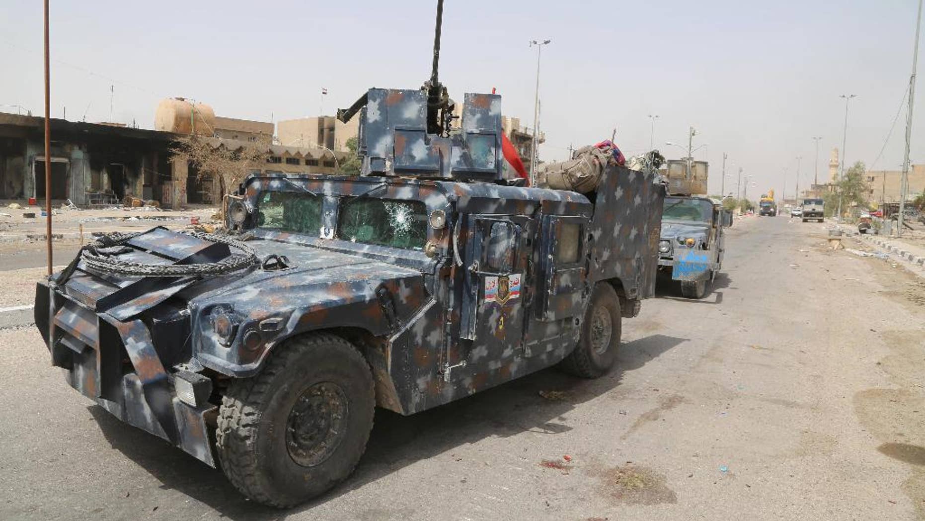 Iraqi security forces patrol in Fallujah, Iraq, Tuesday, June 28, 2016. Iraqi forces declared Sunday they had “fully liberated” Fallujah from the Sunni-led extremist group that took over the city 40 miles (65 kilometers) west of Baghdad more than two years ago. The operation, backed by airstrikes from a U.S.-led coalition, began May 22, and involved a number of different Iraqi security forces: elite special operations troops, federal police, Anbar provincial police, and an umbrella group of government-approved mostly Shiite militias.(AP Photo/Karim Kadim)