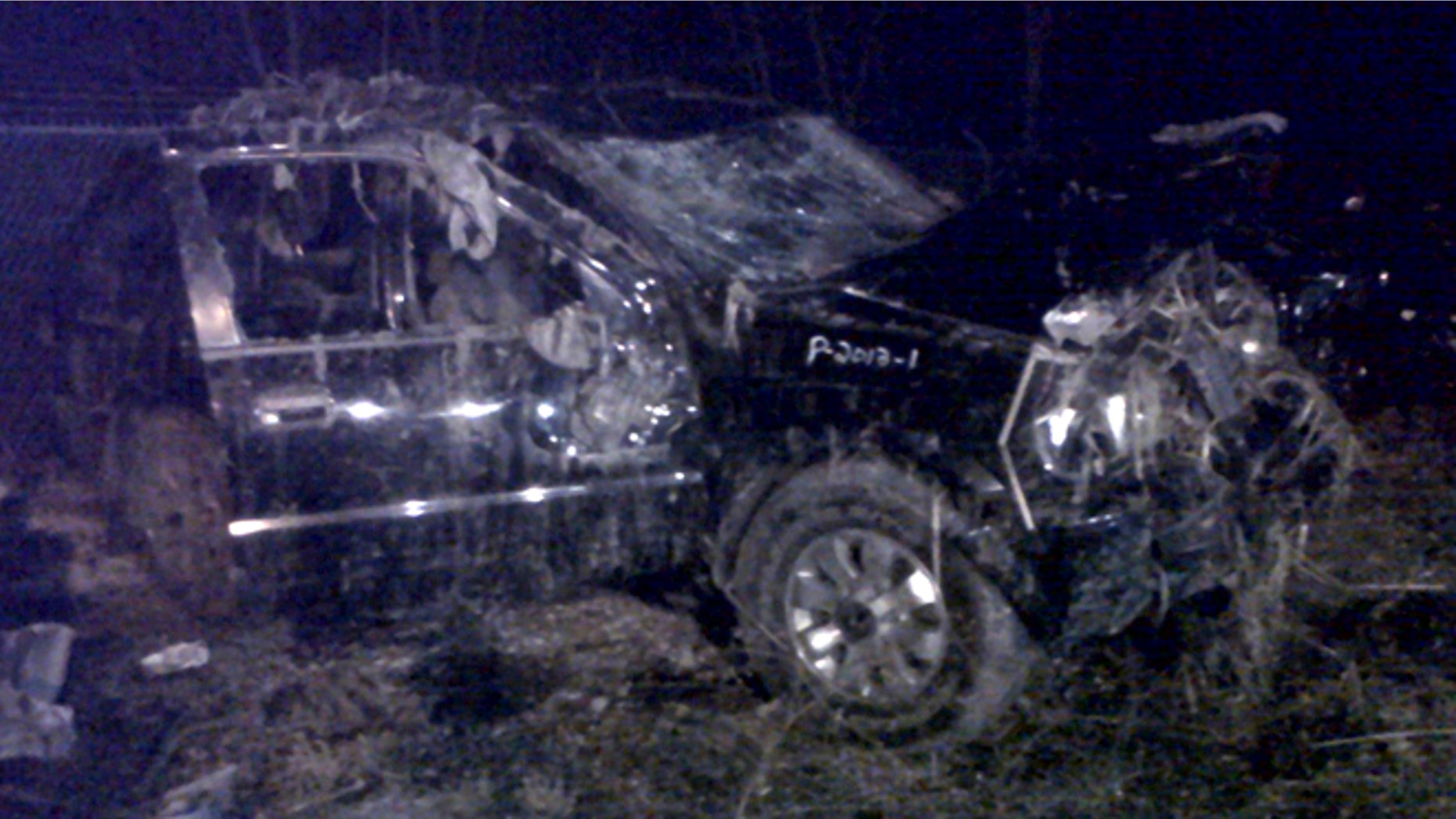 March 10, 2013: This photo shows a Honda Passport that crashed into a guardrail and flipped over into a swampy pond Sunday morning in Warren, Ohio. Highway Patrol officials say speed was a factor in the violent early morning crash of the vehicle that killed six teenagers in northeast Ohio.