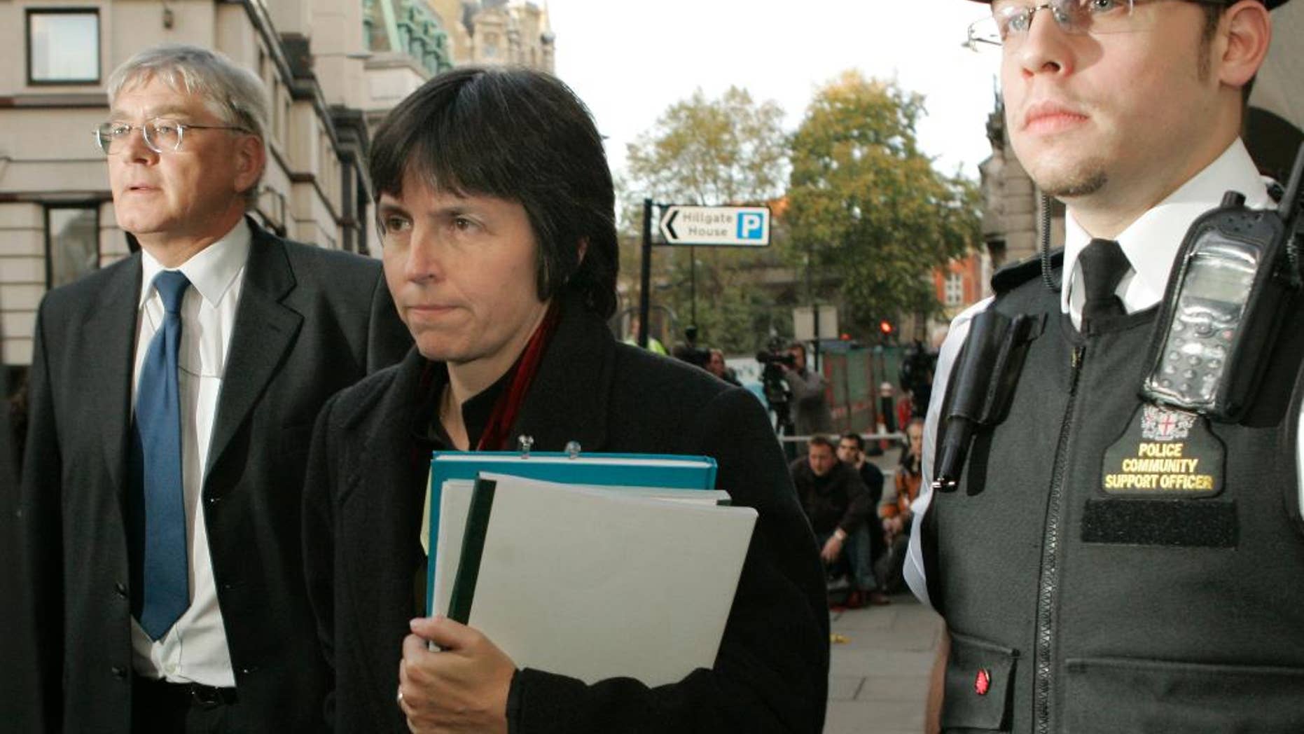 FILE - In this Thursday Nov. 1, 2007 file photo, Deputy Assistant Commissioner Cressida Dick, center, of London's Metropolitan Police leaves the Central Criminal Court in London, following the verdict that London's police force was found guilty of endangering public safety during an anti-terrorist operation that led to the shooting death of a Brazilian man Jean Charles de Menezes. The British government says senior officer Cressida Dick will be the next commissioner of London’s Metropolitan Police - the first woman to lead Scotland Yard in its 188-year history. The Home Office announced the appointment of 56-year-old Dick on Wednesday, Feb. 22, 2017. (AP Photo/Alastair Grant, file)